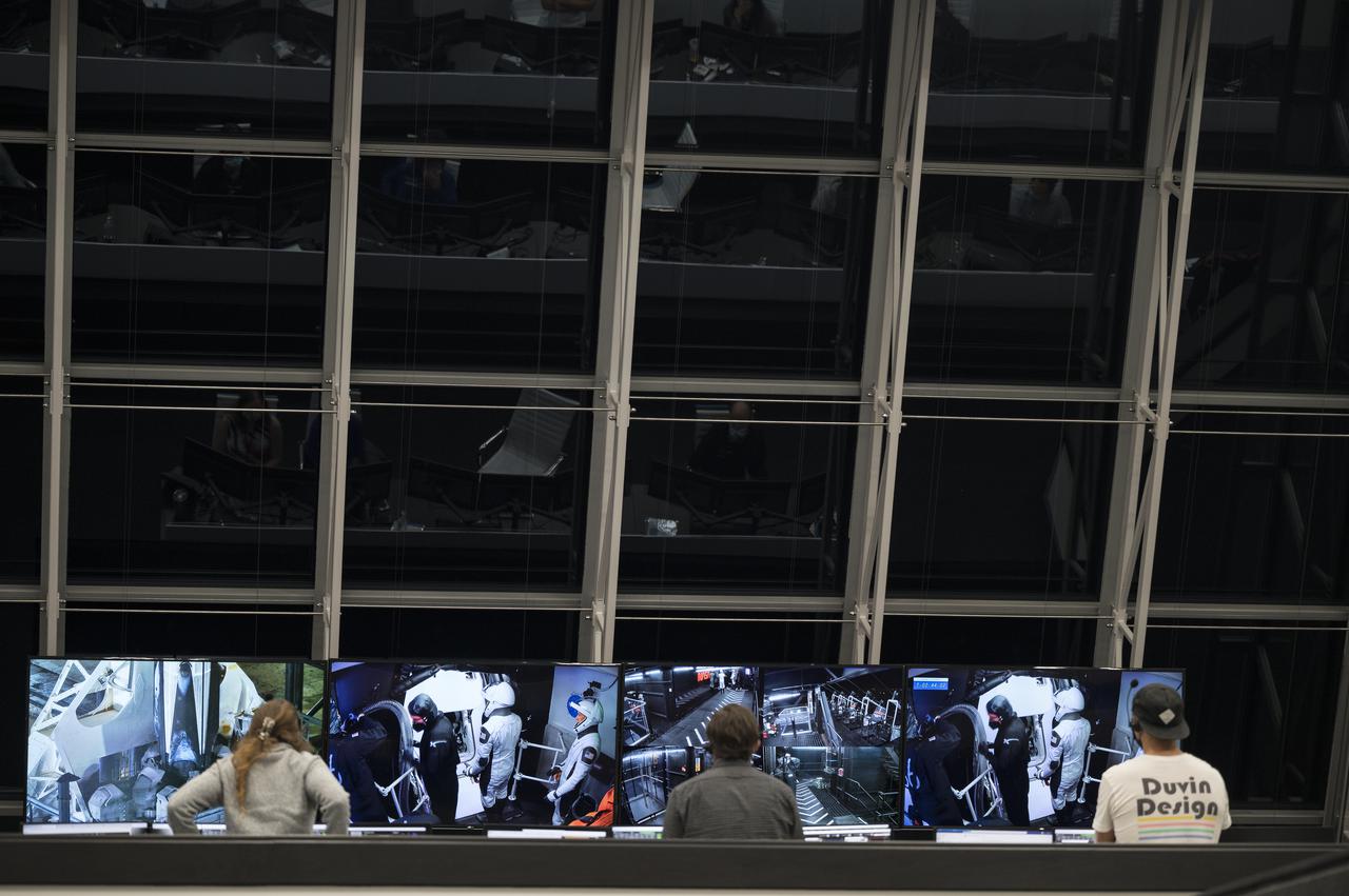SpaceX staff monitor the countdown of the launch of a SpaceX Falcon 9 rocket carrying the company's Crew Dragon spacecraft on NASA’s SpaceX Crew-3 mission with NASA astronauts Raja Chari, Tom Marshburn, Kayla Barron, and ESA (European Space Agency) astronaut Matthias Maurer onboard, Wednesday, Nov. 10, 2021, in firing room four of the Launch Control Center at NASA’s Kennedy Space Center in Florida. NASA’s SpaceX Crew-3 mission is the first crew rotation mission of the SpaceX Crew Dragon spacecraft and Falcon 9 rocket to the International Space Station as part of the agency’s Commercial Crew Program. Chari, Marshburn, Barron, Maurer are scheduled to launch at 9:03 p.m. EST, from Launch Complex 39A at the Kennedy Space Center. Photo Credit: (NASA/Aubrey Gemignani)