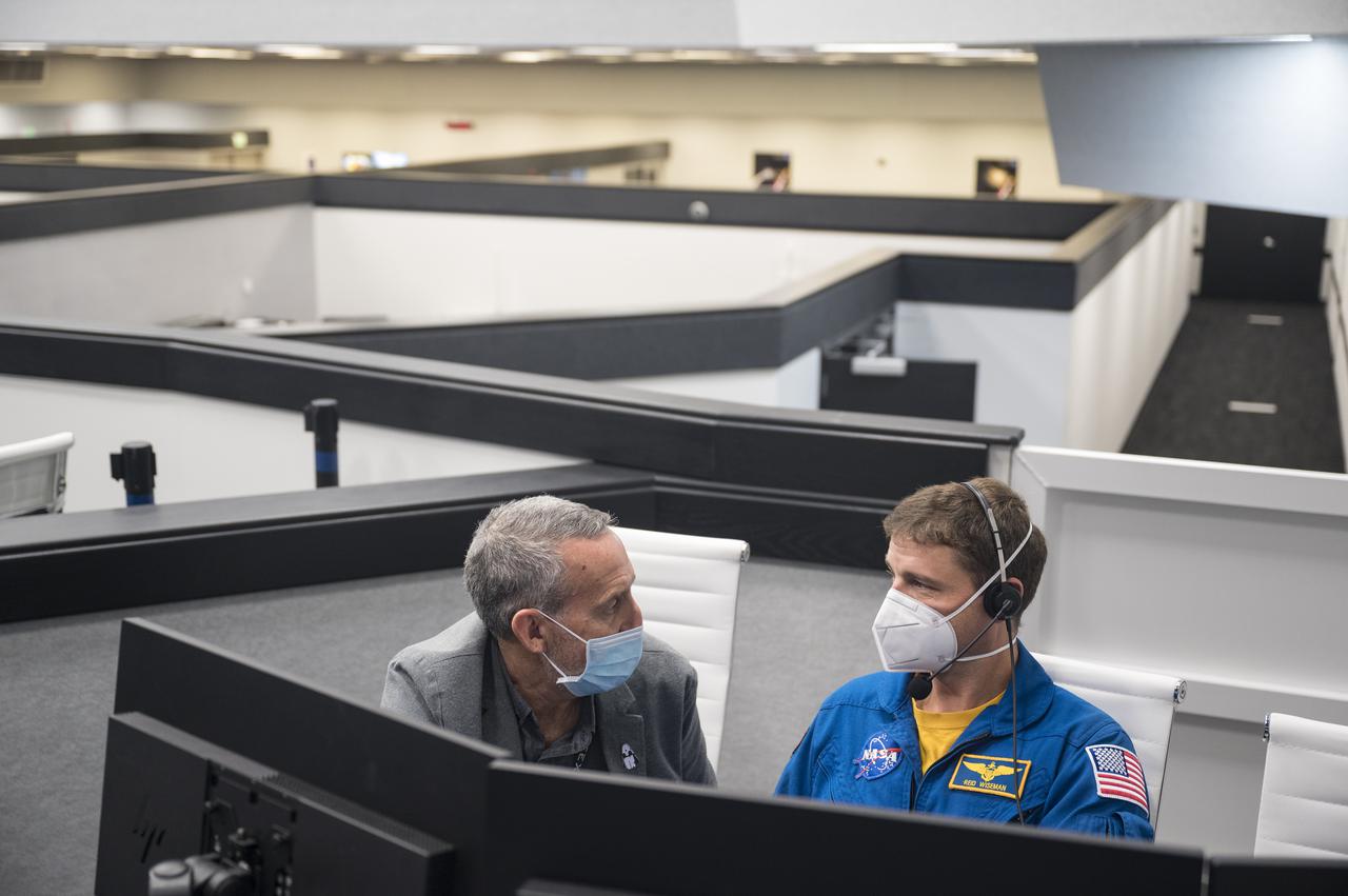 Lee Rosen, vice president of Mission and Launch Operations at SpaceX, left, and Reid Wiseman, Chief of the Astronaut Office, monitor the countdown of the launch of a SpaceX Falcon 9 rocket carrying the company's Crew Dragon spacecraft on NASA’s SpaceX Crew-3 mission with NASA astronauts Raja Chari, Tom Marshburn, Kayla Barron, and ESA (European Space Agency) astronaut Matthias Maurer onboard, Wednesday, Nov. 10, 2021, in firing room four of the Launch Control Center at NASA’s Kennedy Space Center in Florida. NASA’s SpaceX Crew-3 mission is the first crew rotation mission of the SpaceX Crew Dragon spacecraft and Falcon 9 rocket to the International Space Station as part of the agency’s Commercial Crew Program. Chari, Marshburn, Barron, Maurer are scheduled to launch at 9:03 p.m. EST, from Launch Complex 39A at the Kennedy Space Center. Photo Credit: (NASA/Aubrey Gemignani)