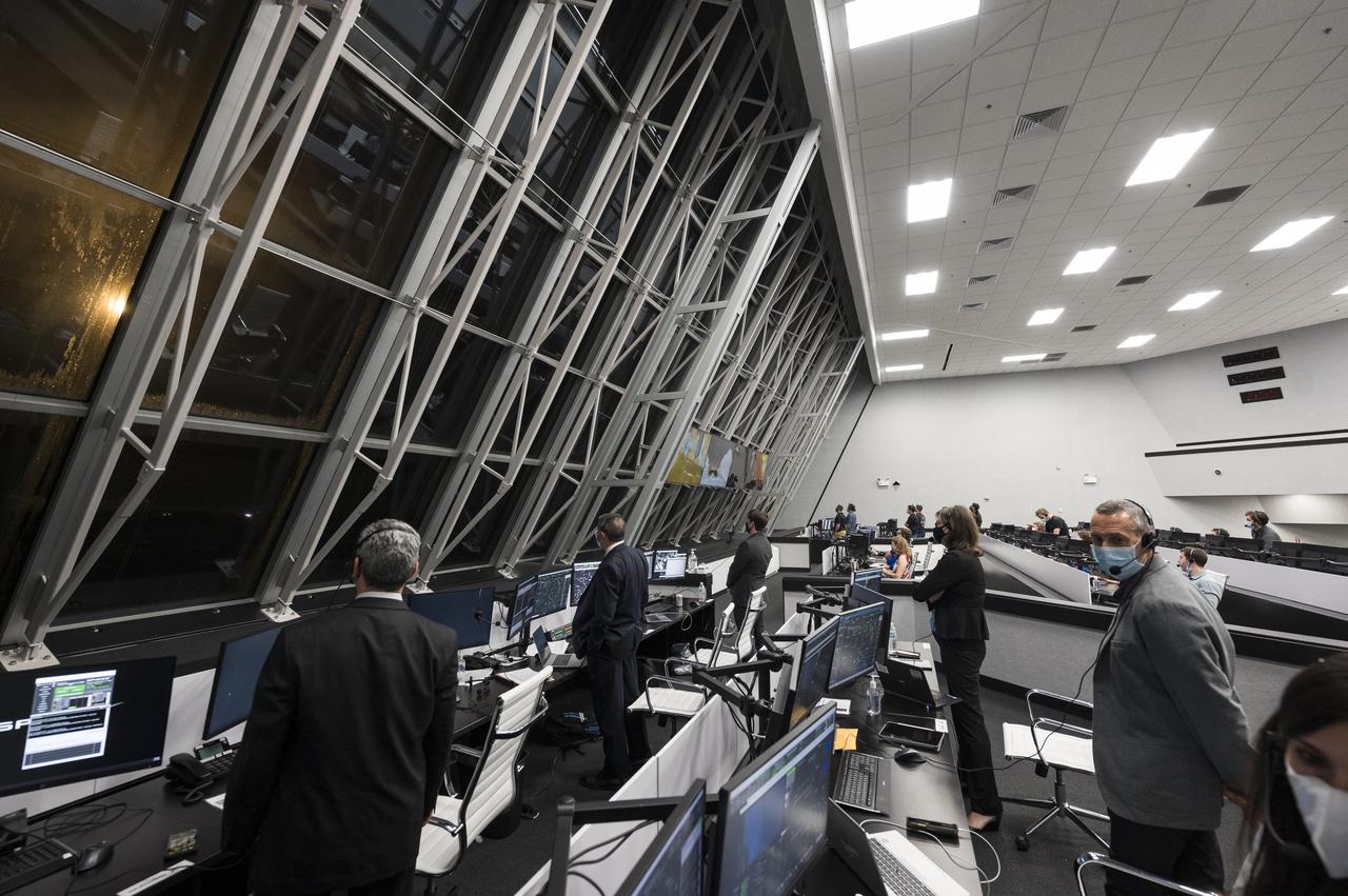 NASA and SpaceX officials monitor the launch of a SpaceX Falcon 9 rocket carrying the company's Crew Dragon spacecraft on the Crew-3 mission with NASA astronauts Raja Chari, Tom Marshburn, Kayla Barron, and ESA (European Space Agency) astronaut Matthias Maurer onboard, Wednesday, Nov. 10, 2021, in  firing room four of the Launch Control Center at NASA’s Kennedy Space Center in Florida. NASA’s SpaceX Crew-3 mission is the third crew rotation mission of the SpaceX Crew Dragon spacecraft and Falcon 9 rocket to the International Space Station as part of the agency’s Commercial Crew Program. Chari, Marshburn, Barron, Maurer launched at 9:03 p.m. EST, from Launch Complex 39A at the Kennedy Space Center. Photo Credit: (NASA/Aubrey Gemignani)