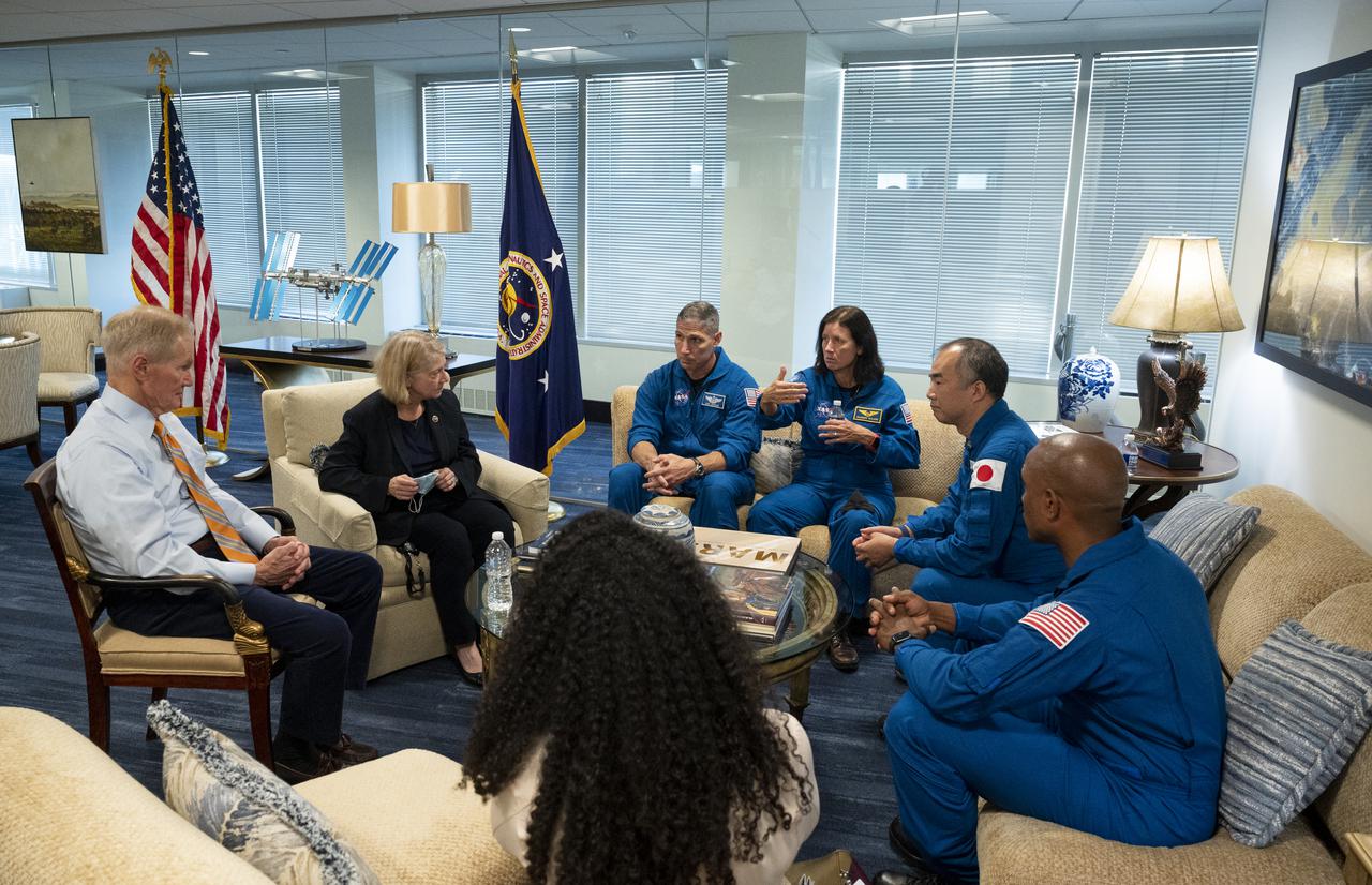 NASA Administrator Bill Nelson, left, and NASA Deputy Administrator Pam Melroy, second from left, meet with SpaceX Crew-1 NASA astronauts Mike Hopkins, third from left, Shannon Walker, third from right, Japan Aerospace Exploration Agency (JAXA) astronaut Soichi Noguchi, second from right, and NASA astronaut Victor Glover, right, Monday, Nov. 15, 2021, at the Mary W. Jackson NASA Headquarters Building in Washington. Hopkins, Glover, Walker, and Noguchi launched on the first crew rotation mission to the International Space Station for SpaceX’s Falcon 9 and Crew Dragon spacecraft as part of the agency’s Commercial Crew Program and spent 168 days in space across Expeditions 64 and 65. Photo Credit: (NASA/Joel Kowsky)