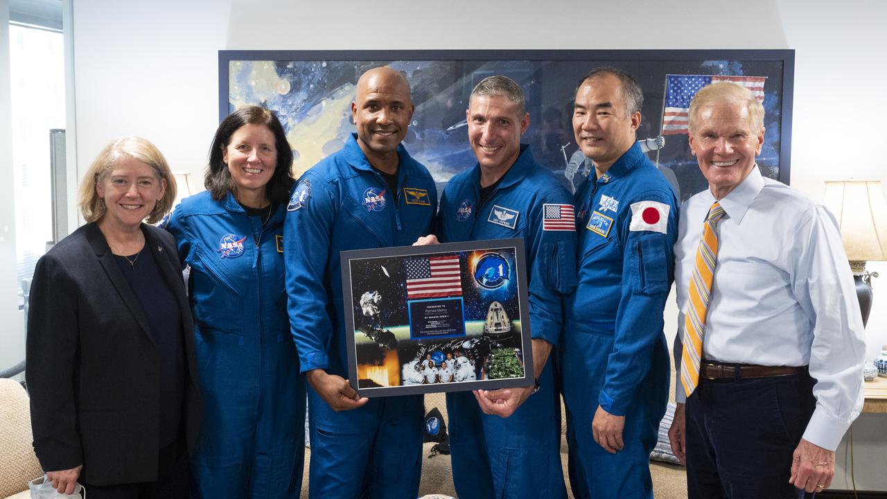 NASA Administrator Bill Nelson, right, and NASA Deputy Administrator Pam Melroy, left, pose for a picture with SpaceX Crew-1 NASA astronauts Shannon Walker, second from left, Victor Glover, third from left, Mike Hopkins, third from right, and Japan Aerospace Expolration Agency (JAXA) astronaut Soichi Noguchi, second from right, Monday, Nov. 15, 2021, at the Mary W. Jackson NASA Headquarters Building in Washington. Hopkins, Glover, Walker, and Noguchi launched on the first crew rotation mission to the International Space Station for SpaceX’s Falcon 9 and Crew Dragon spacecraft as part of the agency’s Commercial Crew Program and spent 168 days in space across Expeditions 64 and 65. Photo Credit: (NASA/Joel Kowsky)