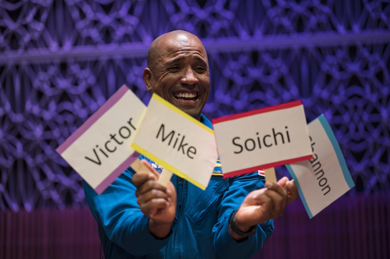 SpaceX Crew-1 NASA astronaut Victor Glover, holds up cards in answer to an interview question in the Oprah Winfrey Theater at the National Museum of African American History and Culture, Tuesday, Nov. 16, 2021, in Washington. Glover and crew mates NASA astronauts Shannon Walker and Mike Hopkins, and Japan Aerospace Exploration Agency (JAXA) astronaut Soichi Noguchi, launched on the first crew rotation mission to the International Space Station for SpaceX’s Falcon 9 and Crew Dragon spacecraft as part of the agency’s Commercial Crew Program and spent 168 days in space across Expeditions 64 and 65. Photo Credit: (NASA/Aubrey Gemignani)