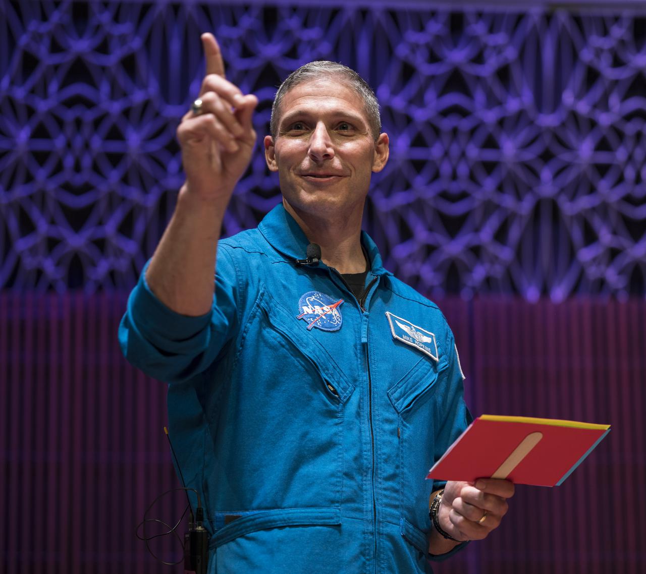 SpaceX Crew-1 NASA astronaut Mike Hopkins reacts after an interview question in the Oprah Winfrey Theater at the National Museum of African American History and Culture, Tuesday, Nov. 16, 2021, in Washington. Hopkins, and crew mates NASA astronauts Shannon Walker and Victor Glover, and Japan Aerospace Exploration Agency (JAXA) astronaut Soichi Noguchi, launched on the first crew rotation mission to the International Space Station for SpaceX’s Falcon 9 and Crew Dragon spacecraft as part of the agency’s Commercial Crew Program and spent 168 days in space across Expeditions 64 and 65. Photo Credit: (NASA/Aubrey Gemignani)