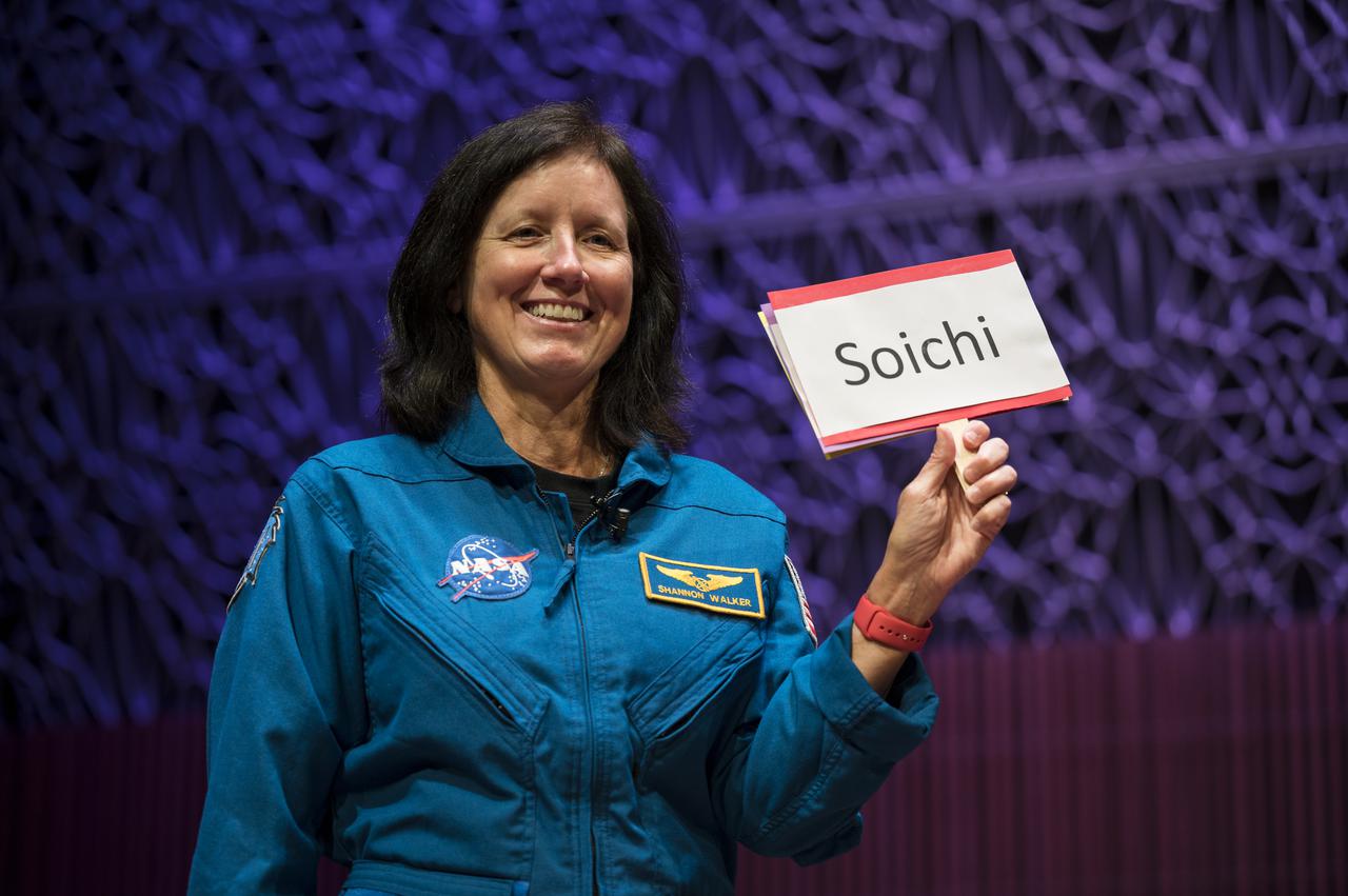 SpaceX Crew-1 NASA astronaut Shannon Walker holds up a card in answer to an interview question in the Oprah Winfrey Theater at the National Museum of African American History and Culture, Tuesday, Nov. 16, 2021, in Washington. Walker and crew mates NASA astronauts Victor Glover and Mike Hopkins, and Japan Aerospace Exploration Agency (JAXA) astronaut Soichi Noguchi, launched on the first crew rotation mission to the International Space Station for SpaceX’s Falcon 9 and Crew Dragon spacecraft as part of the agency’s Commercial Crew Program and spent 168 days in space across Expeditions 64 and 65. Photo Credit: (NASA/Aubrey Gemignani)