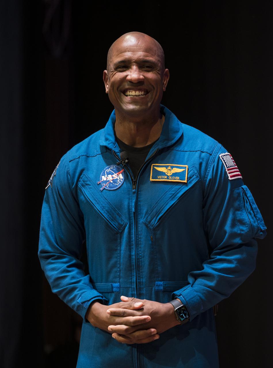 SpaceX Crew-1 NASA astronaut Victor Glover reacts during an interview with Christopher Williams, STEM educator at the National Museum of African American History and Culture (NMAAHC) in the Oprah Winfrey Theater at the NMAAHC, Tuesday, Nov. 16, 2021, in Washington. Glover and crew mates NASA astronauts Shannon Walker and Mike Hopkins, and Japan Aerospace Exploration Agency (JAXA) astronaut Soichi Noguchi, launched on the first crew rotation mission to the International Space Station for SpaceX’s Falcon 9 and Crew Dragon spacecraft as part of the agency’s Commercial Crew Program and spent 168 days in space across Expeditions 64 and 65. Photo Credit: (NASA/Aubrey Gemignani)