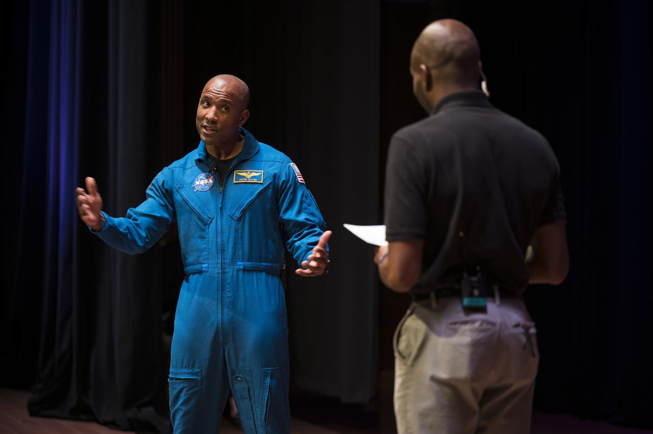 SpaceX Crew-1 NASA astronaut Victor Glover reacts during an interview with Christopher Williams, STEM educator at the National Museum of African American History and Culture (NMAAHC) in the Oprah Winfrey Theater at the NMAAHC, Tuesday, Nov. 16, 2021, in Washington. Glover and crew mates NASA astronauts Shannon Walker and Mike Hopkins, and Japan Aerospace Exploration Agency (JAXA) astronaut Soichi Noguchi, launched on the first crew rotation mission to the International Space Station for SpaceX’s Falcon 9 and Crew Dragon spacecraft as part of the agency’s Commercial Crew Program and spent 168 days in space across Expeditions 64 and 65. Photo Credit: (NASA/Aubrey Gemignani)