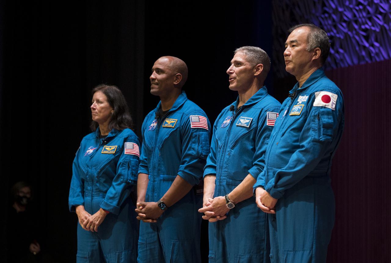 SpaceX Crew-1 NASA astronauts, from left to right, Shannon Walker, Victor Glover, Mike Hopkins, and Japan Aerospace Exploration Agency (JAXA) astronaut Soichi Noguchi, give a presentation about their mission in the Oprah Winfrey Theater at the National Museum of African American History and Culture, Tuesday, Nov. 16, 2021, in Washington. Hopkins, Glover, Walker, and Noguchi launched on the first crew rotation mission to the International Space Station for SpaceX’s Falcon 9 and Crew Dragon spacecraft as part of the agency’s Commercial Crew Program and spent 168 days in space across Expeditions 64 and 65. Photo Credit: (NASA/Aubrey Gemignani)