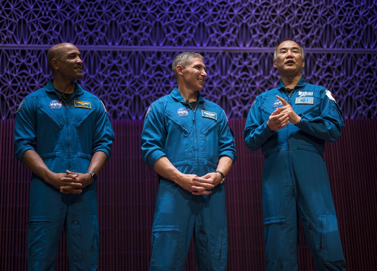 SpaceX Crew-1 NASA astronauts, from left to right, Victor Glover, Mike Hopkins, and Japan Aerospace Exploration Agency (JAXA) astronaut Soichi Noguchi, give a presentation about their mission in the Oprah Winfrey Theater at the National Museum of African American History and Culture, Tuesday, Nov. 16, 2021, in Washington. Hopkins, Glover, Noguchi and NASA astronaut Shannon Walker (not pictured) launched on the first crew rotation mission to the International Space Station for SpaceX’s Falcon 9 and Crew Dragon spacecraft as part of the agency’s Commercial Crew Program and spent 168 days in space across Expeditions 64 and 65. Photo Credit: (NASA/Aubrey Gemignani)