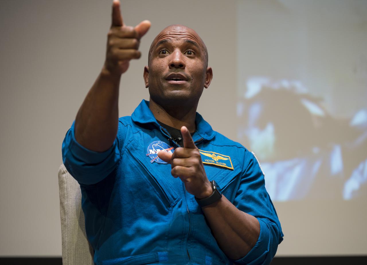 SpaceX Crew-1 NASA astronaut Victor Glover, gestures during a live question and answer session in the Oprah Winfrey Theater at the National Museum of African American History and Culture, Tuesday, Nov. 16, 2021, in Washington. Glover and crew mates NASA Astronauts Shannon Walker and Mike Hopkins, and Japan Aerospace Exploration Agency (JAXA) astronaut Soichi Noguchi launched on the first crew rotation mission to the International Space Station for SpaceX’s Falcon 9 and Crew Dragon spacecraft as part of the agency’s Commercial Crew Program and spent 168 days in space across Expeditions 64 and 65. Photo Credit: (NASA/Aubrey Gemignani)
