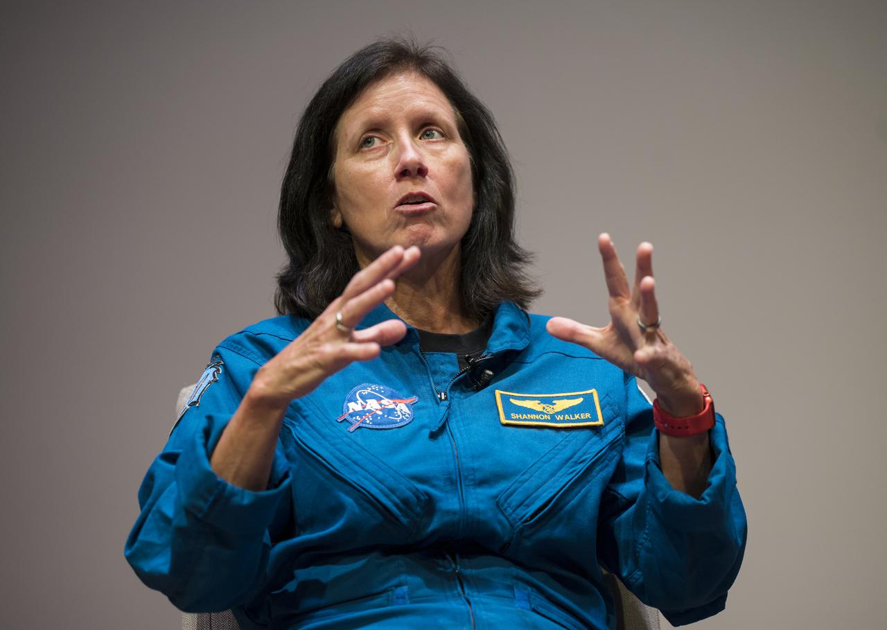 SpaceX Crew-1 NASA astronaut Shannon Walker answers a question during a live question and answer session in the Oprah Winfrey Theater at the National Museum of African American History and Culture, Tuesday, Nov. 16, 2021, in Washington. Walker and crew mates NASA astronauts Victor Glover and Mike Hopkins, and Japan Aerospace Exploration Agency (JAXA) astronaut Soichi Noguchi, launched on the first crew rotation mission to the International Space Station for SpaceX’s Falcon 9 and Crew Dragon spacecraft as part of the agency’s Commercial Crew Program and spent 168 days in space across Expeditions 64 and 65. Photo Credit: (NASA/Aubrey Gemignani)