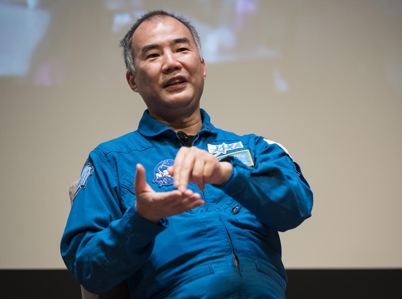 SpaceX Crew-1 Japan Aerospace Exploration Agency (JAXA) astronaut Soichi Noguchi answers a question during a live question and answer session in the Oprah Winfrey Theater at the National Museum of African American History and Culture, Tuesday, Nov. 16, 2021, in Washington. Noguchi and crew mates NASA astronauts Shannon Walker, Victor Glover, and Mike Hopkins launched on the first crew rotation mission to the International Space Station for SpaceX’s Falcon 9 and Crew Dragon spacecraft as part of the agency’s Commercial Crew Program and spent 168 days in space across Expeditions 64 and 65. Photo Credit: (NASA/Aubrey Gemignani)