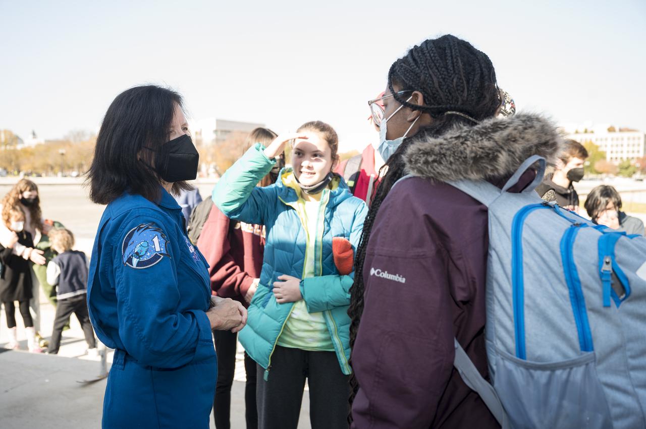SpaceX Crew-1 NASA astronaut Shannon Walker speaks with visitors at the Destination Station mobile exhibition on Capitol Hill, Wednesday, Nov. 17, 2021, in Washington. Walker, and NASA astronauts Mike Hopkins, and Victor Glover, and Japan Aerospace Exploration Agency (JAXA) astronaut Soichi Noguchi launched on the first crew rotation mission to the International Space Station for SpaceX’s Falcon 9 and Crew Dragon spacecraft as part of the agency’s Commercial Crew Program and spent 168 days in space across Expeditions 64 and 65. Photo Credit: (NASA/Aubrey Gemignani)