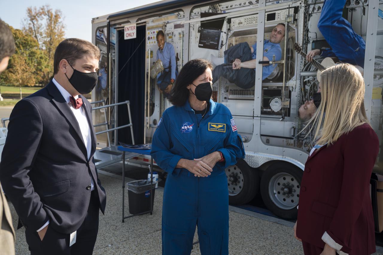 SpaceX Crew-1 NASA astronaut Shannon Walker speaks with visitors at the Destination Station mobile exhibition on Capitol Hill, Wednesday, Nov. 17, 2021, in Washington. Walker, and NASA astronauts Mike Hopkins, and Victor Glover, and Japan Aerospace Exploration Agency (JAXA) astronaut Soichi Noguchi launched on the first crew rotation mission to the International Space Station for SpaceX’s Falcon 9 and Crew Dragon spacecraft as part of the agency’s Commercial Crew Program and spent 168 days in space across Expeditions 64 and 65. Photo Credit: (NASA/Aubrey Gemignani)