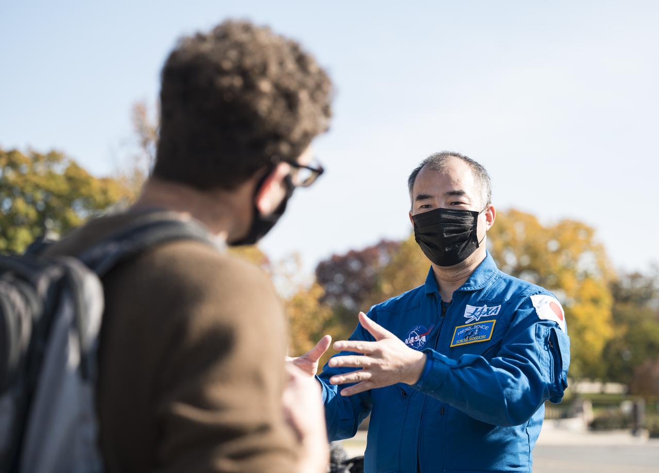 Japan Aerospace Exploration Agency (JAXA) astronaut Soichi Noguchi speaks with visitors at the Destination Station mobile exhibition on Capitol Hill, Wednesday, Nov. 17, 2021, in Washington. Noguchi and crew mates NASA astronauts Mike Hopkins, Victor Glover, and Shannon Walker, launched on the first crew rotation mission to the International Space Station for SpaceX’s Falcon 9 and Crew Dragon spacecraft as part of the agency’s Commercial Crew Program and spent 168 days in space across Expeditions 64 and 65. Photo Credit: (NASA/Aubrey Gemignani)