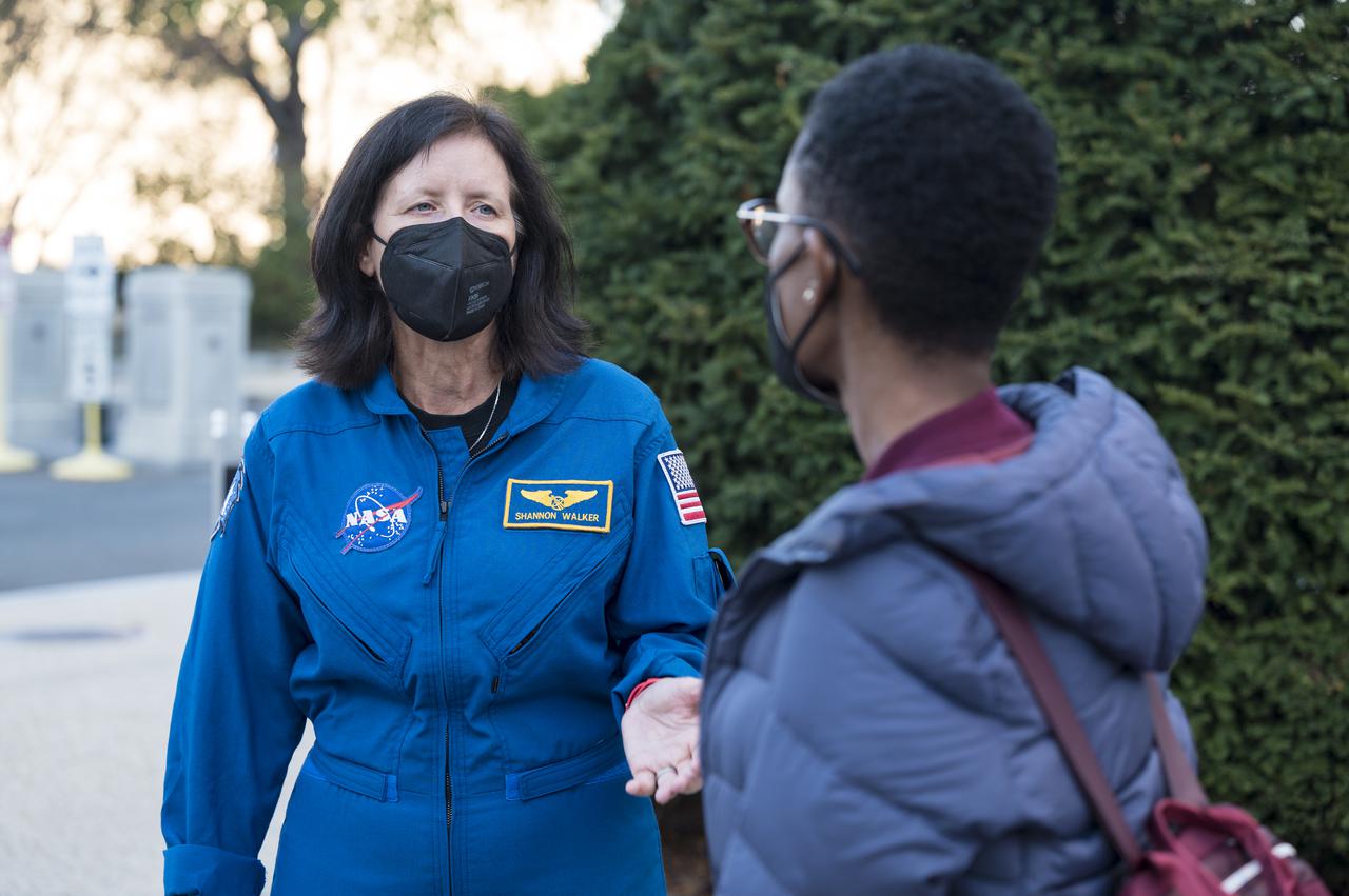 SpaceX Crew-1 NASA astronaut Shannon Walker speaks with visitors at the Destination Station mobile exhibition on Capitol Hill, Wednesday, Nov. 17, 2021, in Washington. Walker, and NASA astronauts Mike Hopkins, and Victor Glover, and Japan Aerospace Exploration Agency (JAXA) astronaut Soichi Noguchi launched on the first crew rotation mission to the International Space Station for SpaceX’s Falcon 9 and Crew Dragon spacecraft as part of the agency’s Commercial Crew Program and spent 168 days in space across Expeditions 64 and 65. Photo Credit: (NASA/Aubrey Gemignani)