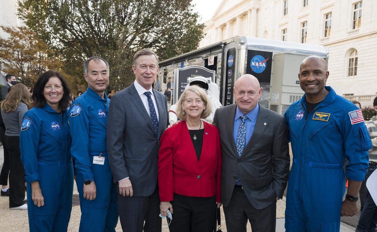 From left to right, SpaceX Crew-1 NASA astronaut Shannon Walker, Japan Aerospace Exploration Agency (JAXA) astronaut Soichi Noguchi, Senator John Hickenlooper, D-Colo, NASA Deputy Administrator Pam Melroy, Senator Mark Kelly, D-Ariz., and NASA astronaut Victor Glover, pose for a photo at the Destination Station mobile exhibition on Capitol Hill, Wednesday, Nov. 17, 2021, in Washington. Walker, Glover, Noguchi, and NASA astronaut Mike Hopkins, launched on the first crew rotation mission to the International Space Station for SpaceX’s Falcon 9 and Crew Dragon spacecraft as part of the agency’s Commercial Crew Program and spent 168 days in space across Expeditions 64 and 65. Photo Credit: (NASA/Aubrey Gemignani)