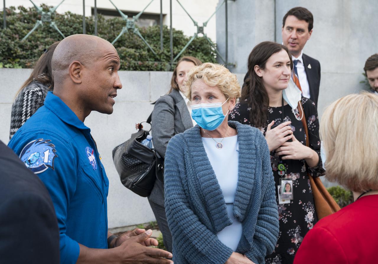 SpaceX Crew-1 NASA astronaut Victor Glover, left, speaks with Rep. Chrissy Houlahan, D-Pa., center, and NASA Deputy Administrator Pam Melroy, at the Destination Station mobile exhibition on Capitol Hill, Wednesday, Nov. 17, 2021, in Washington. Glover, and NASA astronauts Mike Hopkins, and Shannon Walker, and Japan Aerospace Exploration Agency (JAXA) astronaut Soichi Noguchi launched on the first crew rotation mission to the International Space Station for SpaceX’s Falcon 9 and Crew Dragon spacecraft as part of the agency’s Commercial Crew Program and spent 168 days in space across Expeditions 64 and 65. Photo Credit: (NASA/Aubrey Gemignani)