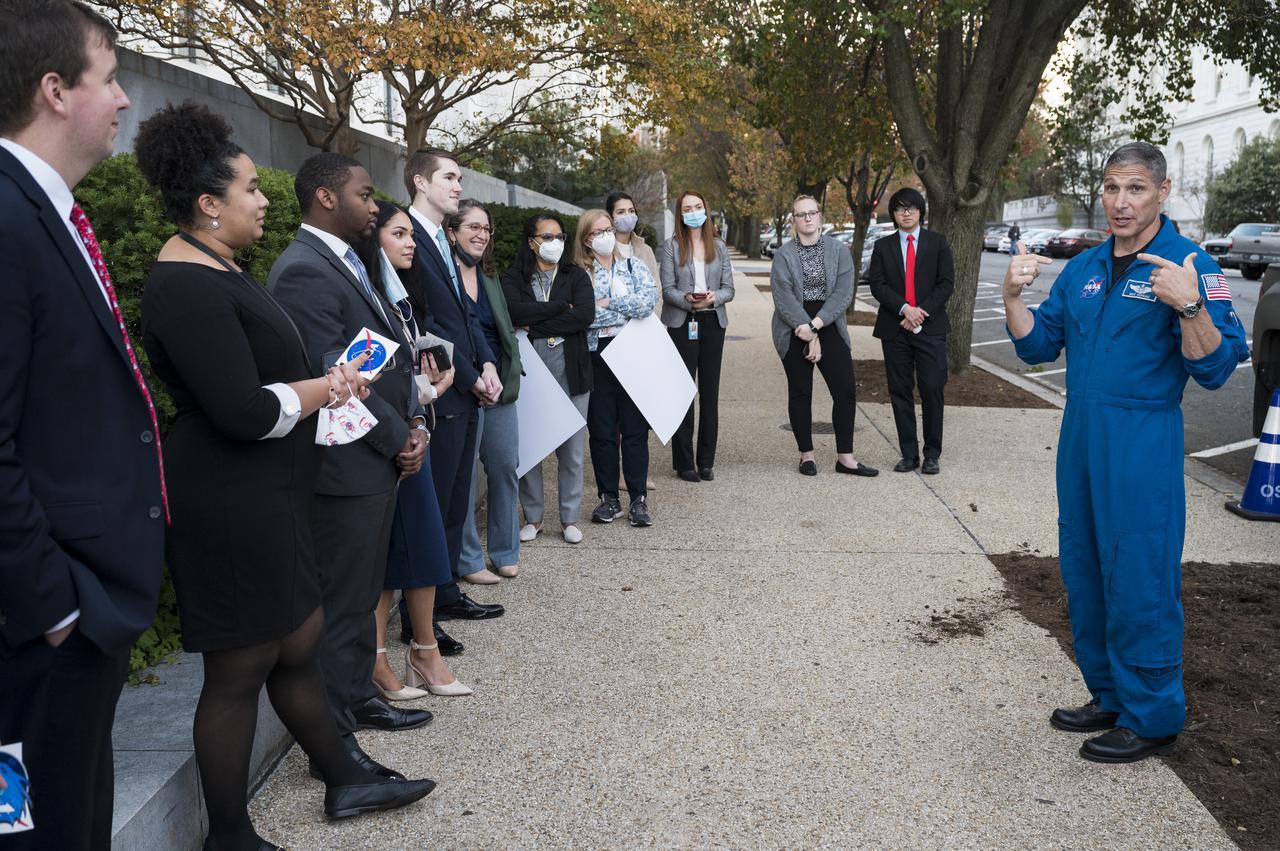 SpaceX Crew-1 NASA astronaut Mike Hopkins speaks with visitors at the Destination Station mobile exhibition on Capitol Hill, Wednesday, Nov. 17, 2021, in Washington. Hopkins, and NASA astronauts Shannon Walker and Victor Glover, and Japan Aerospace Exploration Agency (JAXA) astronaut Soichi Noguchi launched on the first crew rotation mission to the International Space Station for SpaceX’s Falcon 9 and Crew Dragon spacecraft as part of the agency’s Commercial Crew Program and spent 168 days in space across Expeditions 64 and 65. Photo Credit: (NASA/Aubrey Gemignani)