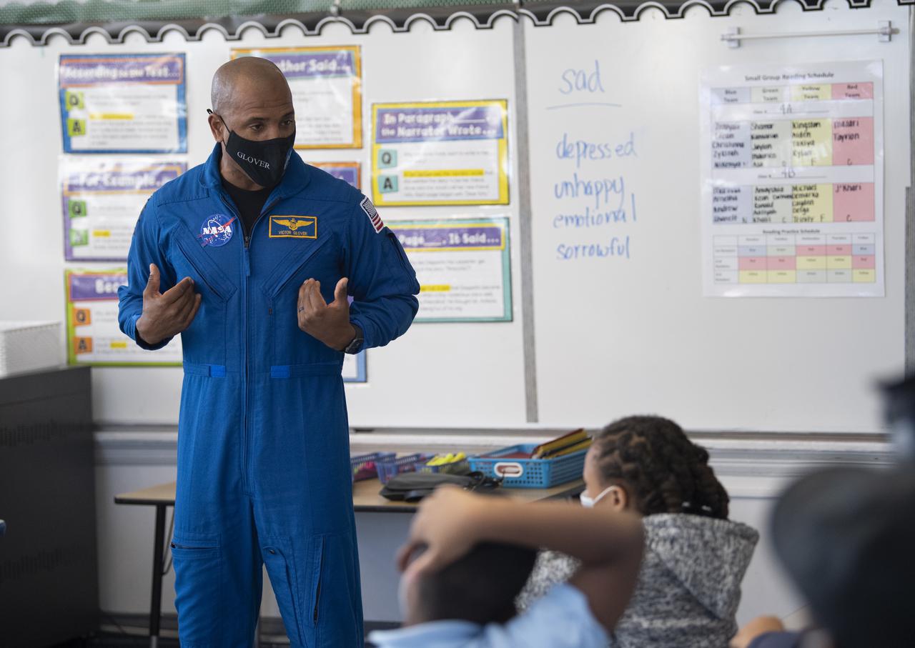 NASA astronaut Victor Glover speaks with students about his time aboard the International Space Station during the Crew-1 mission, Thursday, Nov. 18, 2021, at Garfield Elementary School in Washington, DC. Glover and fellow NASA astronauts Shannon Walker, Mike Hopkins, and Japan Aerospace Exploration Agency (JAXA) astronaut Soichi Noguchi launched on the first crew rotation mission to the International Space Station for SpaceX’s Falcon 9 and Crew Dragon spacecraft as part of the agency’s Commercial Crew Program and spent 168 days in space across Expeditions 64 and 65. Photo Credit: (NASA/Joel Kowsky)