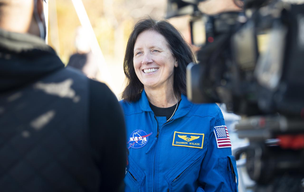 NASA astronaut Shannon Walker is interviewed by the media during a visit to Garfield Elementary School with fellow NASA astronauts Victor Glover and Mike Hopkins, Thursday, Nov. 18, 2021, Washington, DC. Walker, Hopkins, Glover, and Japan Aerospace Exploration Agency (JAXA) astronaut Soichi Noguchi launched on the first crew rotation mission to the International Space Station for SpaceX’s Falcon 9 and Crew Dragon spacecraft as part of the agency’s Commercial Crew Program and spent 168 days in space across Expeditions 64 and 65. Photo Credit: (NASA/Joel Kowsky)