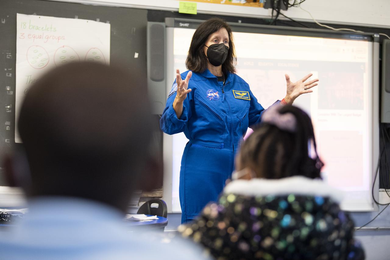 NASA astronaut Shannon Walker speaks with students about her time aboard the International Space Station during the Crew-1 mission, Thursday, Nov. 18, 2021, at Garfield Elementary School in Washington, DC. Walker and fellow NASA astronauts Victor Glover, Mike Hopkins, and Japan Aerospace Exploration Agency (JAXA) astronaut Soichi Noguchi launched on the first crew rotation mission to the International Space Station for SpaceX’s Falcon 9 and Crew Dragon spacecraft as part of the agency’s Commercial Crew Program and spent 168 days in space across Expeditions 64 and 65. Photo Credit: (NASA/Joel Kowsky)