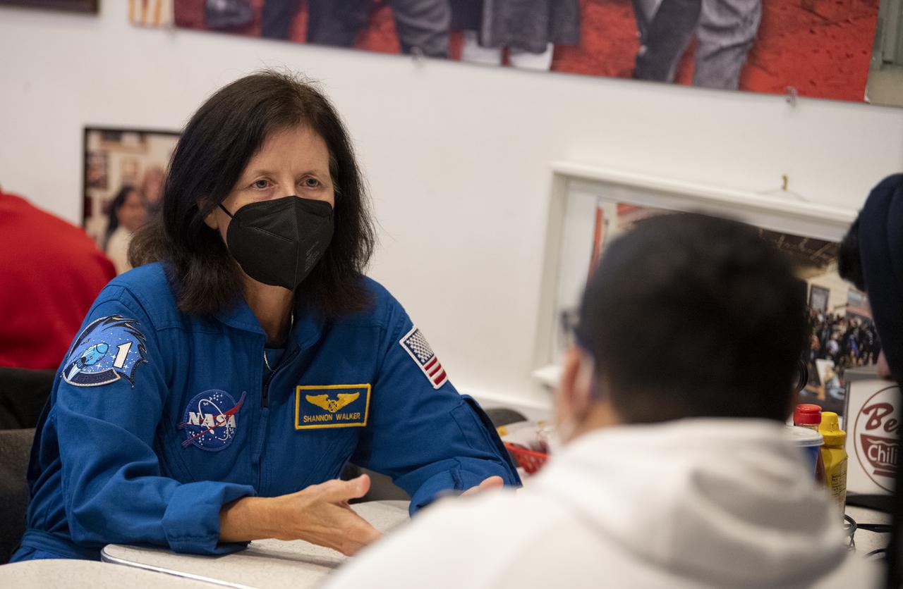 NASA astronaut Shannon Walker speaks with students from about his time aboard the International Space Station, Thursday, Nov. 18, 2021, at Ben’s Chili Bowl in Washington, DC. Students from Cardozo Educational Campus, Friendship Technology Preparatory High School, McKinley Technical High School, Phelps High School, and Wilson High School heard NASA astronauts Walker, Mike Hopkins, and Victor Glover speak about the Crew-1 mission, the first crew rotation mission to the International Space Station for SpaceX’s Falcon 9 and Crew Dragon spacecraft as part of the agency’s Commercial Crew Program and the 168 days they spent in space across Expeditions 64 and 65. Photo Credit: (NASA/Joel Kowsky)