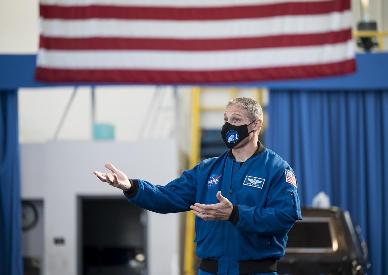 SpaceX Crew-1 NASA astronaut Mike Hopkins speaks with the U.S. Air Force Honor Guard Drill Team at Joint Base Anacostia-Bolling (JBAB), Friday, Nov. 19, 2021, in Washington. Hopkins, and crew mates NASA Astronauts Victor Glover, Shannon Walker, and Japan Aerospace Exploration Agency (JAXA) astronaut Soichi Noguchi, launched on the first crew rotation mission to the International Space Station for SpaceX’s Falcon 9 and Crew Dragon spacecraft as part of the agency’s Commercial Crew Program and spent 168 days in space across Expeditions 64 and 65. Photo Credit: (NASA/Aubrey Gemignani)