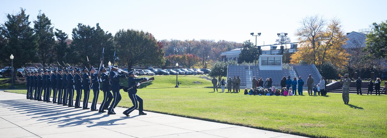 SpaceX Crew-1 NASA astronauts Victor Glover, Shannon Walker, and Mike Hopkins, watch the U.S. Air Force Honor Guard Drill Team perform at Joint Base Anacostia-Bolling (JBAB), Friday, Nov. 19, 2021, in Washington. Hopkins, Glover, Walker, and Japan Aerospace Exploration Agency (JAXA) astronaut Soichi Noguchi, launched on the first crew rotation mission to the International Space Station for SpaceX’s Falcon 9 and Crew Dragon spacecraft as part of the agency’s Commercial Crew Program and spent 168 days in space across Expeditions 64 and 65. Photo Credit: (NASA/Aubrey Gemignani)