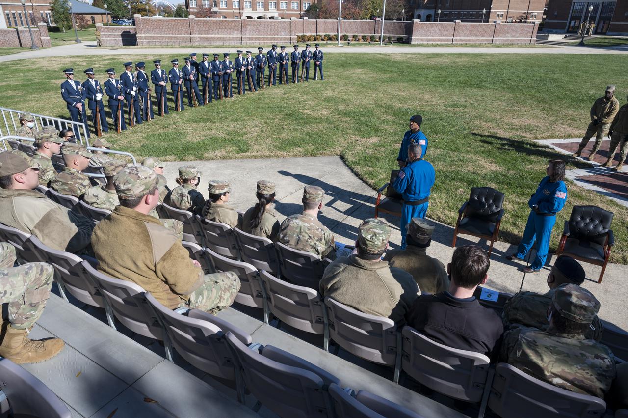 SpaceX Crew-1 NASA astronaut Mike Hopkins, right center, along with crew mates NASA astronauts Shannon Walker, right, and Victor Glover, left, thank the U.S. Air Force Honor Guard Drill Team for their performance at Joint Base Anacostia-Bolling (JBAB), Friday, Nov. 19, 2021, in Washington. Hopkins, Glover, Walker, and Japan Aerospace Exploration Agency (JAXA) astronaut Soichi Noguchi, launched on the first crew rotation mission to the International Space Station for SpaceX’s Falcon 9 and Crew Dragon spacecraft as part of the agency’s Commercial Crew Program and spent 168 days in space across Expeditions 64 and 65. Photo Credit: (NASA/Aubrey Gemignani)