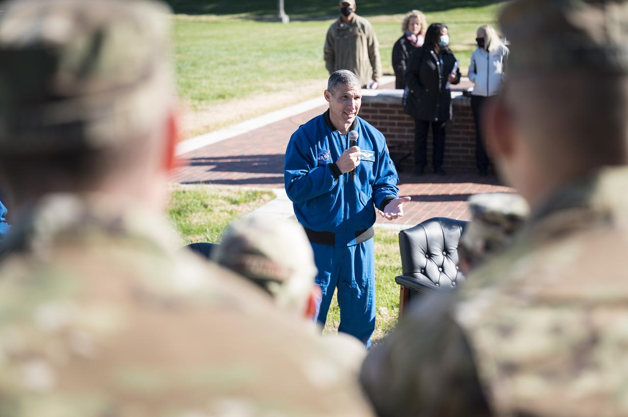 SpaceX Crew-1 NASA astronaut Mike Hopkins answers a question from a Junior Officer at Joint Base Anacostia-Bolling (JBAB), Friday, Nov. 19, 2021, in Washington. Hopkins, and crew mates NASA astronauts Victor Glover, Shannon Walker, and Japan Aerospace Exploration Agency (JAXA) astronaut Soichi Noguchi, launched on the first crew rotation mission to the International Space Station for SpaceX’s Falcon 9 and Crew Dragon spacecraft as part of the agency’s Commercial Crew Program and spent 168 days in space across Expeditions 64 and 65. Photo Credit: (NASA/Aubrey Gemignani)