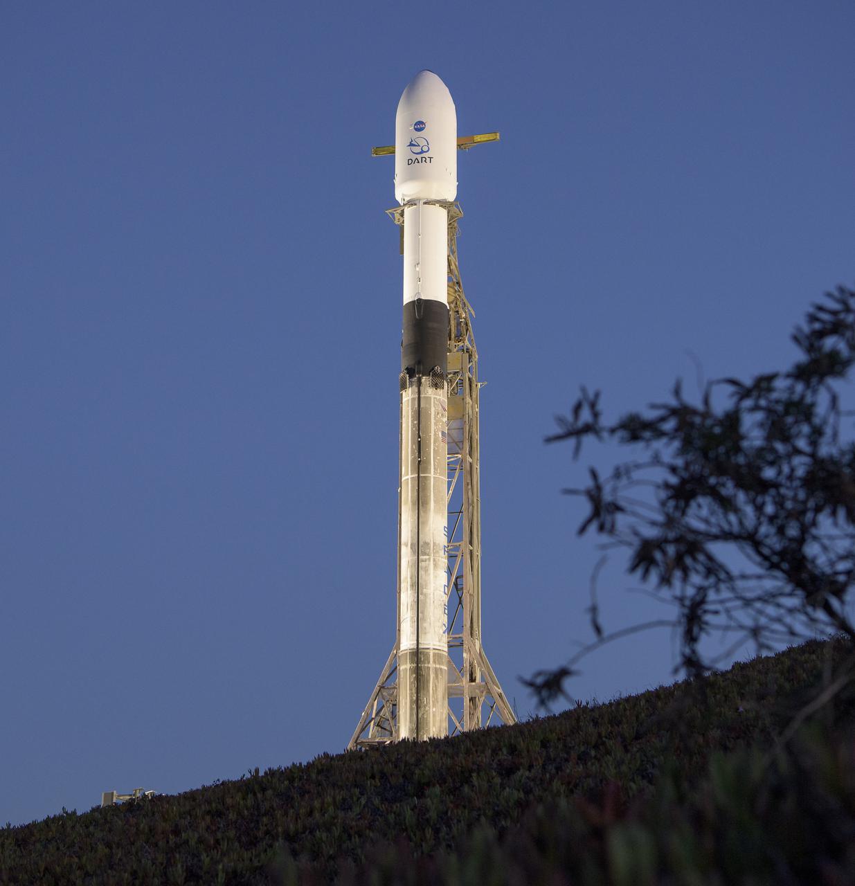 The SpaceX Falcon 9 rocket with the Double Asteroid Redirection Test, or DART, spacecraft onboard, is seen during sunrise, Tuesday, Nov. 23, 2021, at Space Launch Complex 4E, Vandenberg Space Force Base in California. DART is the world’s first full-scale planetary defense test, demonstrating one method of asteroid deflection technology. The mission was built and is managed by the Johns Hopkins APL for NASA’s Planetary Defense Coordination Office. Photo Credit: (NASA/Bill Ingalls)
