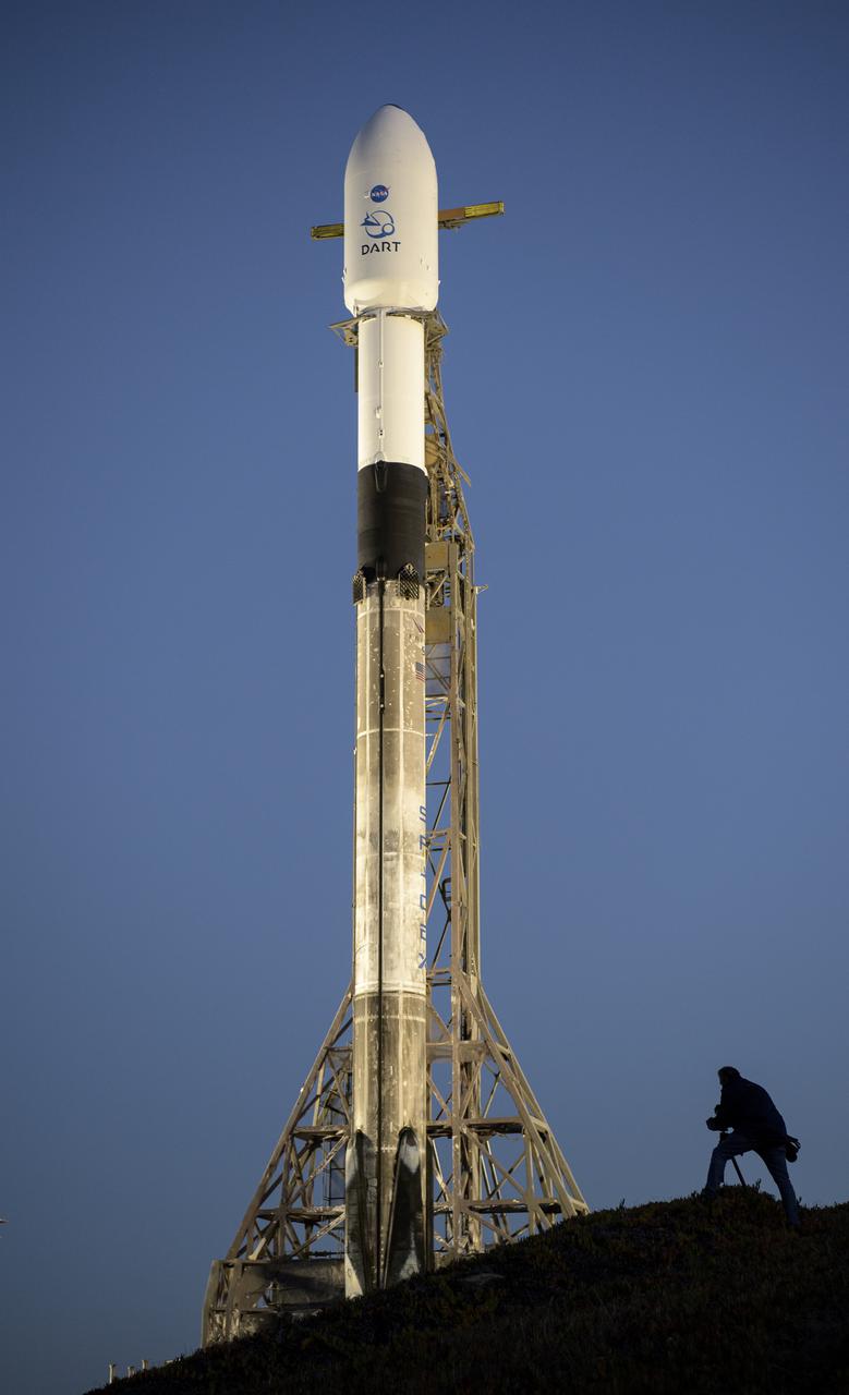 The SpaceX Falcon 9 rocket with the Double Asteroid Redirection Test, or DART, spacecraft onboard, is seen during sunrise, Tuesday, Nov. 23, 2021, at Space Launch Complex 4E, Vandenberg Space Force Base in California. DART is the world’s first full-scale planetary defense test, demonstrating one method of asteroid deflection technology. The mission was built and is managed by the Johns Hopkins APL for NASA’s Planetary Defense Coordination Office. Photo Credit: (NASA/Bill Ingalls)