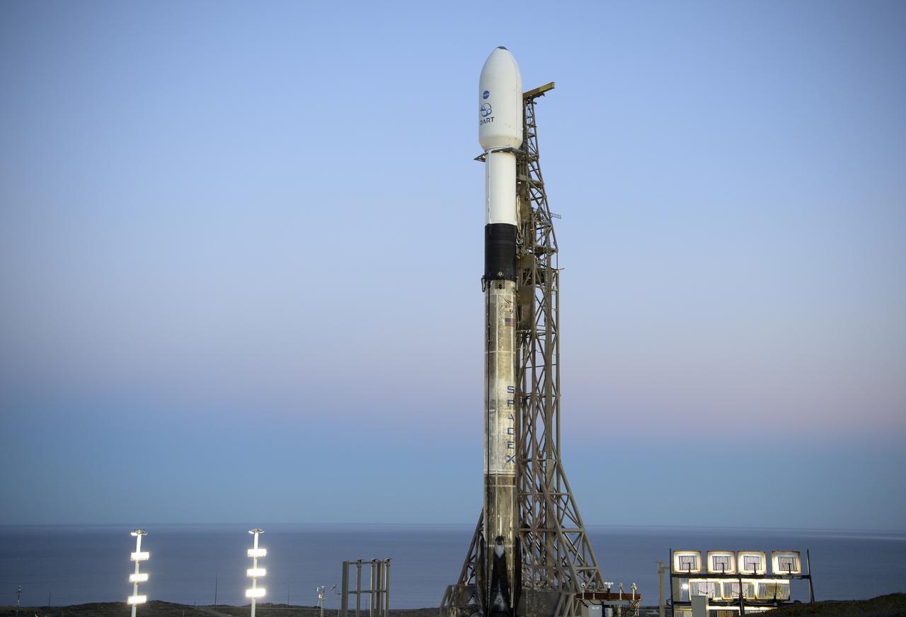 The SpaceX Falcon 9 rocket with the Double Asteroid Redirection Test, or DART, spacecraft onboard, is seen during sunrise, Tuesday, Nov. 23, 2021, at Space Launch Complex 4E, Vandenberg Space Force Base in California. DART is the world’s first full-scale planetary defense test, demonstrating one method of asteroid deflection technology. The mission was built and is managed by the Johns Hopkins APL for NASA’s Planetary Defense Coordination Office. Photo Credit: (NASA/Bill Ingalls)