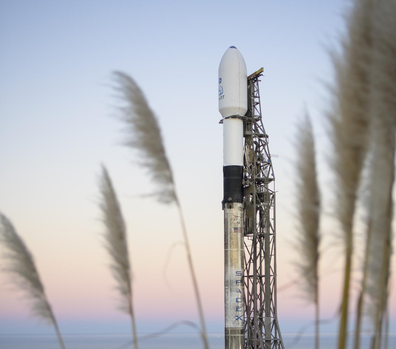 The SpaceX Falcon 9 rocket with the Double Asteroid Redirection Test, or DART, spacecraft onboard, is seen during sunrise, Tuesday, Nov. 23, 2021, at Space Launch Complex 4E, Vandenberg Space Force Base in California. DART is the world’s first full-scale planetary defense test, demonstrating one method of asteroid deflection technology. The mission was built and is managed by the Johns Hopkins APL for NASA’s Planetary Defense Coordination Office. Photo Credit: (NASA/Bill Ingalls)