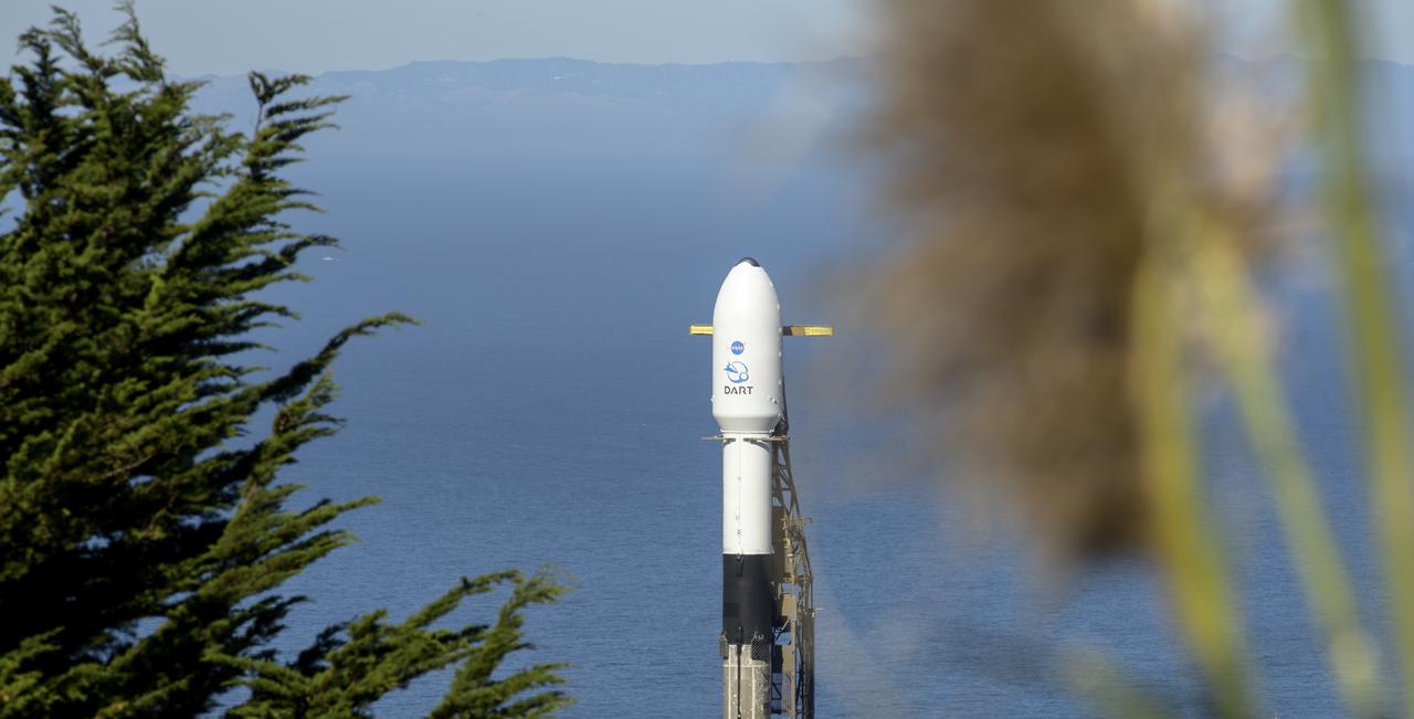 The SpaceX Falcon 9 rocket with the Double Asteroid Redirection Test, or DART, spacecraft onboard, is seen, Tuesday, Nov. 23, 2021, at Space Launch Complex 4E, Vandenberg Space Force Base in California. DART is the world’s first full-scale planetary defense test, demonstrating one method of asteroid deflection technology. The mission was built and is managed by Johns Hopkins APL for NASA’s Planetary Defense Coordination Office. Photo Credit: (NASA/Bill Ingalls)
