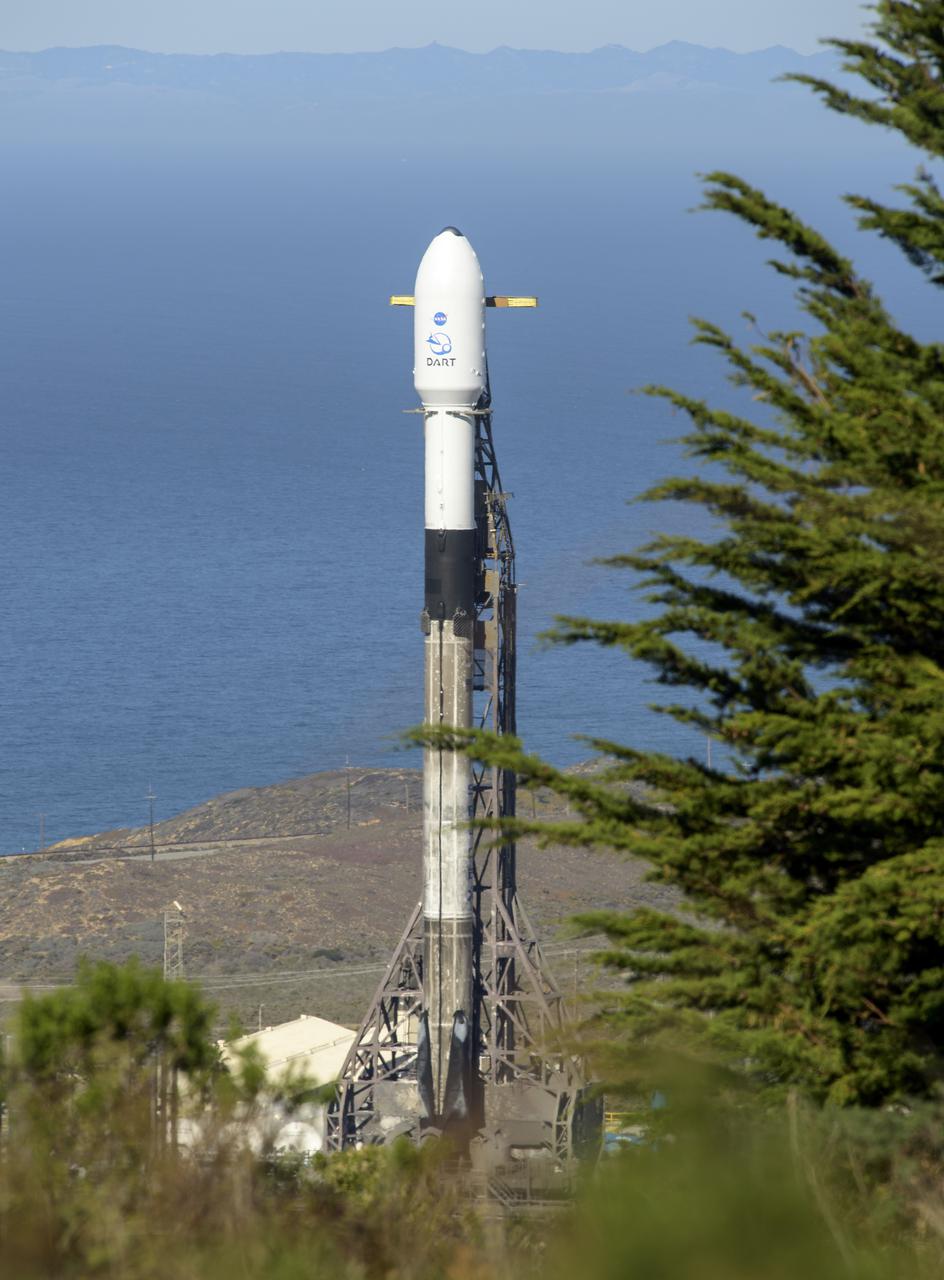 The SpaceX Falcon 9 rocket with the Double Asteroid Redirection Test, or DART, spacecraft onboard, is seen, Tuesday, Nov. 23, 2021, at Space Launch Complex 4E, Vandenberg Space Force Base in California. DART is the world’s first full-scale planetary defense test, demonstrating one method of asteroid deflection technology. The mission was built and is managed by Johns Hopkins APL for NASA’s Planetary Defense Coordination Office. Photo Credit: (NASA/Bill Ingalls)