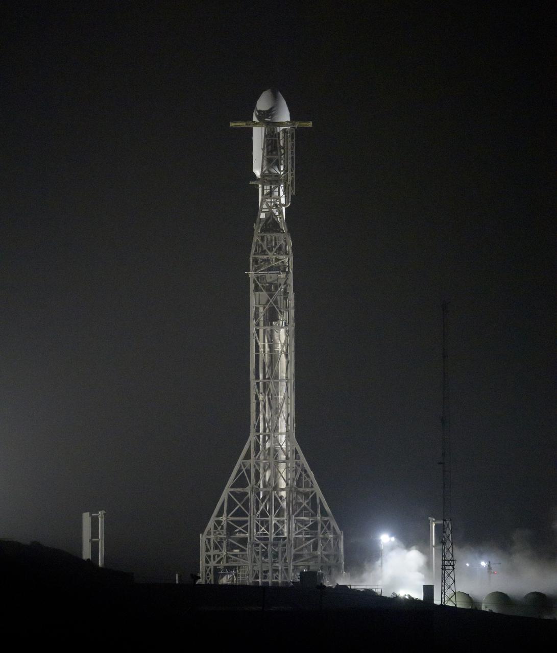 The SpaceX Falcon 9 rocket with the Double Asteroid Redirection Test, or DART, spacecraft onboard, is seen ready for launch, Tuesday, Nov. 23, 2021, at Space Launch Complex 4E, Vandenberg Space Force Base in California. DART is the world’s first full-scale planetary defense test, demonstrating one method of asteroid deflection technology. The mission was built and is managed by Johns Hopkins APL for NASA’s Planetary Defense Coordination Office. Photo Credit: (NASA/Bill Ingalls)