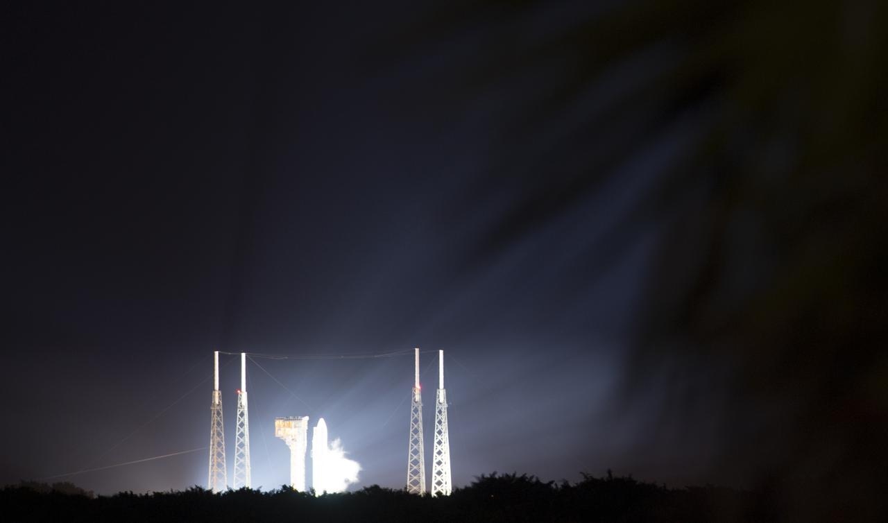 A United Launch Alliance Atlas V rocket carrying the Department of Defense’s Space Test Program 3 (STP-3) mission is seen illuminated by spotlights at Space Launch Complex 41 at Cape Canaveral Space Force Station, Tuesday, Dec. 7, 2021, from NASA’s Kennedy Space Center in Florida. The mission’s Space Test Program Satellite-6 (STPSat-6) spacecraft hosts NASA’s Laser Communications Relay Demonstration (LCRD) and the NASA-U.S. Naval Research Laboratory Ultraviolet Spectro-Coronagraph (UVSC) Pathfinder.  Photo Credit: (NASA/Joel Kowsky)