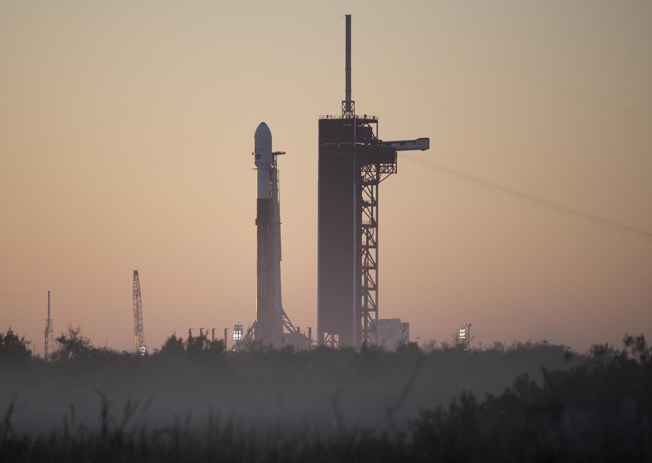 A SpaceX Falcon 9 rocket carrying NASA’s Imaging X-ray Polarimetry Explorer (IXPE) spacecraft is seen on the launch pad at Launch Complex 39A, Wednesday, Dec. 8, 2021, at NASA’s Kennedy Space Center in Florida. The IXPE spacecraft is the first satellite dedicated to measuring the polarization of X-rays from a variety of cosmic sources, such as black holes and neutron stars. Photo Credit: (NASA/Joel Kowsky)
