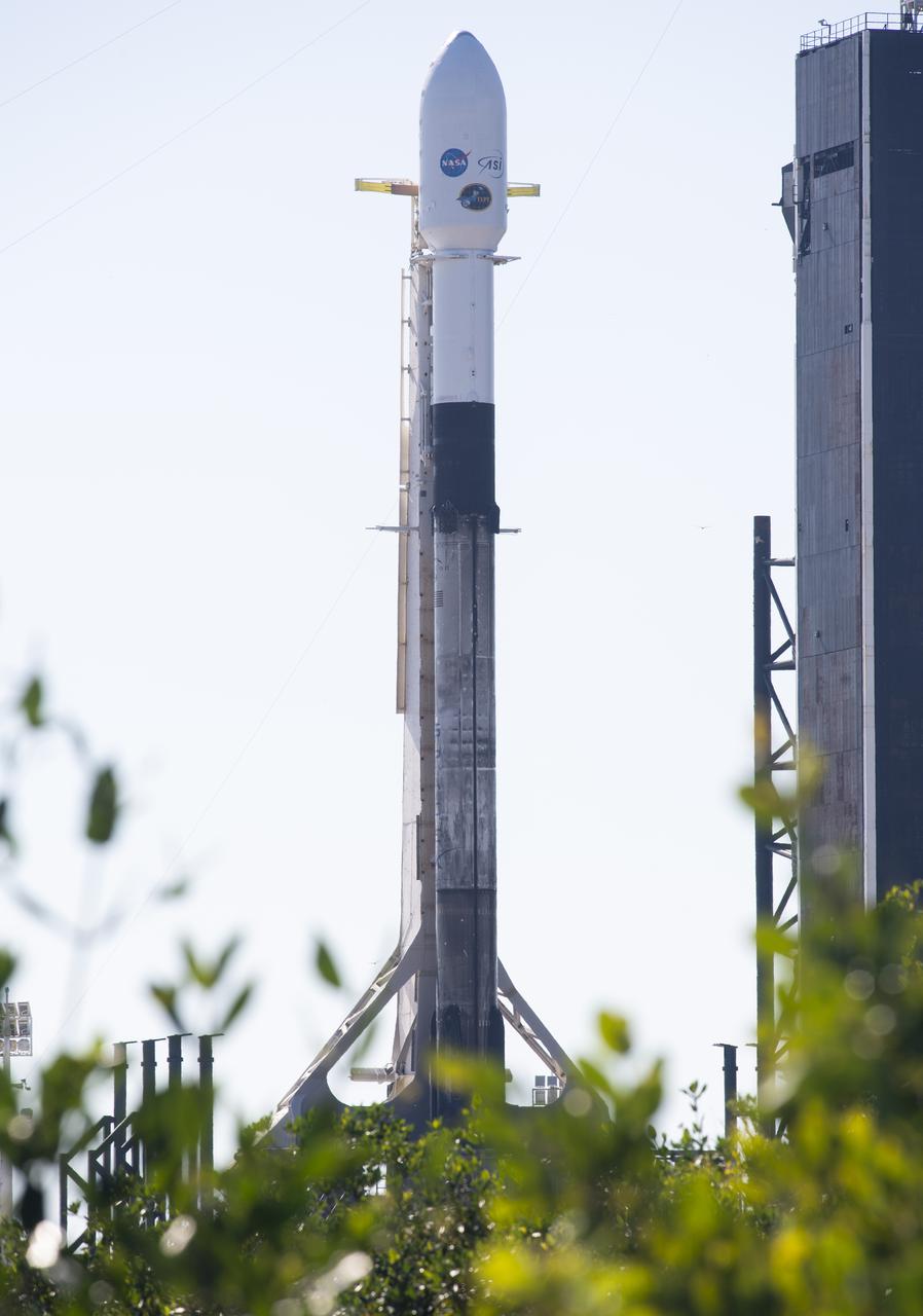 A SpaceX Falcon 9 rocket carrying NASA’s Imaging X-ray Polarimetry Explorer (IXPE) spacecraft is seen on the launch pad at Launch Complex 39A, Wednesday, Dec. 8, 2021, at NASA’s Kennedy Space Center in Florida. The IXPE spacecraft is the first satellite dedicated to measuring the polarization of X-rays from a variety of cosmic sources, such as black holes and neutron stars. Photo Credit: (NASA/Joel Kowsky)