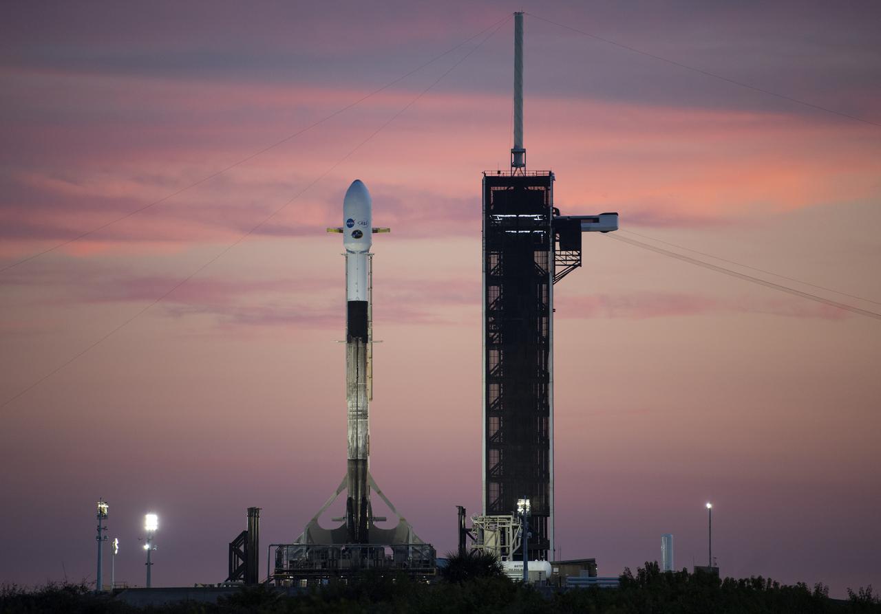 A SpaceX Falcon 9 rocket carrying NASA’s Imaging X-ray Polarimetry Explorer (IXPE) spacecraft is seen at sunset on the launch pad at Launch Complex 39A, Wednesday, Dec. 8, 2021, at NASA’s Kennedy Space Center in Florida. The IXPE spacecraft is the first satellite dedicated to measuring the polarization of X-rays from a variety of cosmic sources, such as black holes and neutron stars. Photo Credit: (NASA/Joel Kowsky)