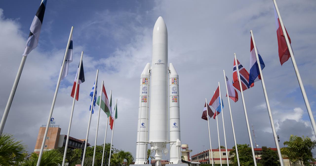 A mockup of Arianespace's Ariane 5 rocket is seen at the entrance to the Guiana Space Center in Kourou, French Guiana, Tuesday, Dec. 21, 2021. The James Webb Space Telescope (sometimes called JWST or Webb) is a large infrared telescope with a 21.3 foot (6.5 meter) primary mirror. The observatory is scheduled to launch later in the week and will study every phase of cosmic history—from within our solar system to the most distant observable galaxies in the early universe. Photo Credit: (NASA/Bill Ingalls)