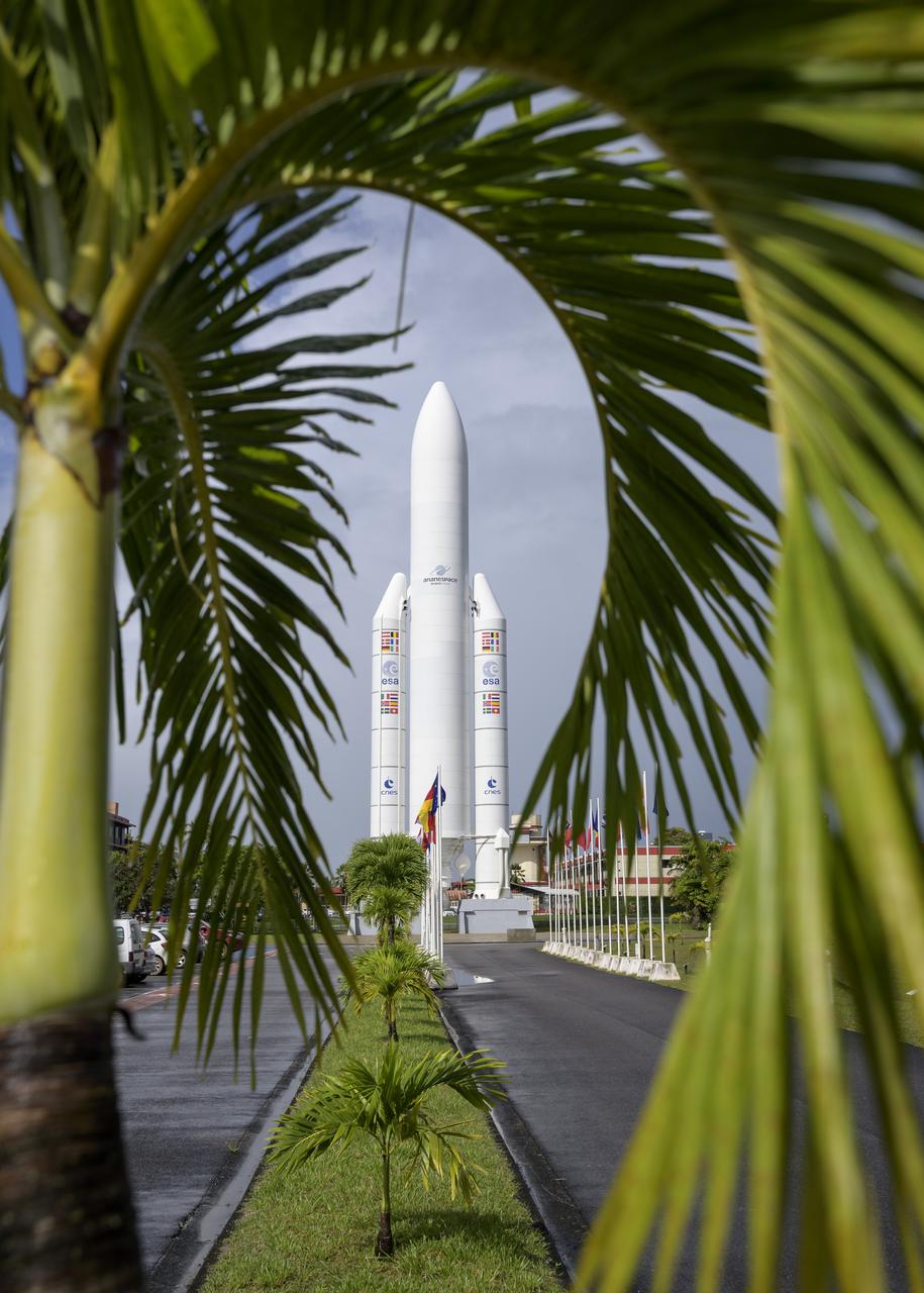 A mockup of Arianespace's Ariane 5 rocket is seen at the entrance to the Guiana Space Center in Kourou, French Guiana, Tuesday, Dec. 21, 2021. The James Webb Space Telescope (sometimes called JWST or Webb) is a large infrared telescope with a 21.3 foot (6.5 meter) primary mirror. The observatory is scheduled to launch later in the week and will study every phase of cosmic history—from within our solar system to the most distant observable galaxies in the early universe. Photo Credit: (NASA/Bill Ingalls)