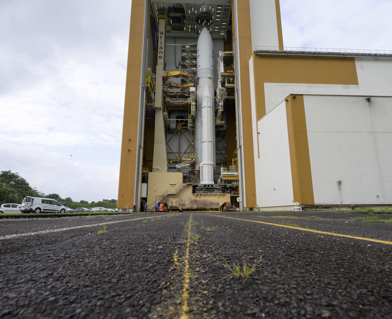 Arianespace's Ariane 5 rocket with NASA’s James Webb Space Telescope onboard, is seen in the final assembly building ahead of the planned roll to the launch pad, Thursday, Dec. 23, 2021, at Europe’s Spaceport, the Guiana Space Center in Kourou, French Guiana. The James Webb Space Telescope (sometimes called JWST or Webb) is a large infrared telescope with a 21.3 foot (6.5 meter) primary mirror. The observatory will study every phase of cosmic history—from within our solar system to the most distant observable galaxies in the early universe. Photo Credit: (NASA/Bill Ingalls)