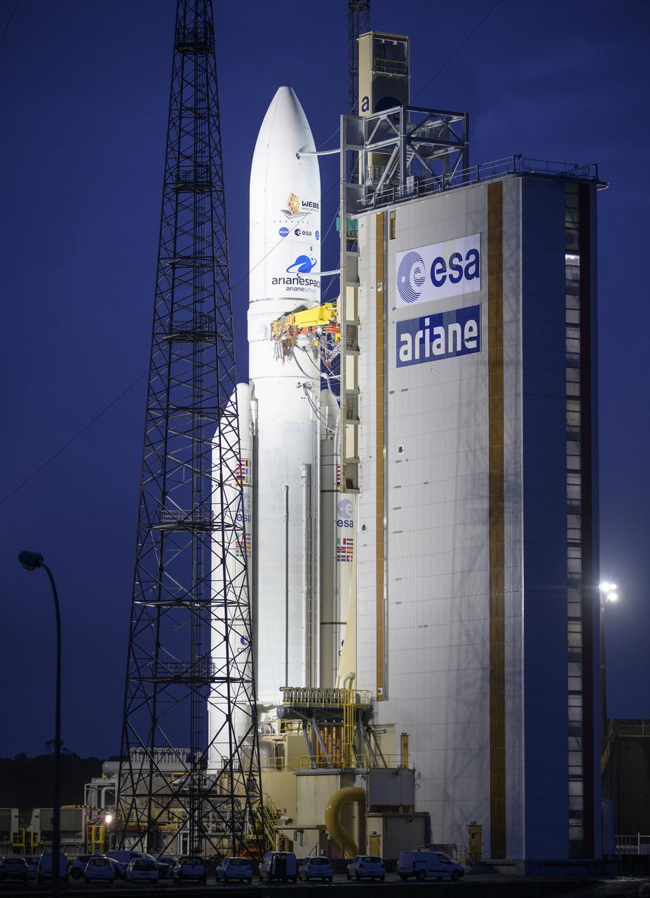 Arianespace's Ariane 5 rocket with NASA’s James Webb Space Telescope onboard, is seen at the launch pad, Thursday, Dec. 23, 2021, at Europe’s Spaceport, the Guiana Space Center in Kourou, French Guiana. The James Webb Space Telescope (sometimes called JWST or Webb) is a large infrared telescope with a 21.3 foot (6.5 meter) primary mirror. The observatory will study every phase of cosmic history—from within our solar system to the most distant observable galaxies in the early universe. Photo Credit: (NASA/Bill Ingalls)