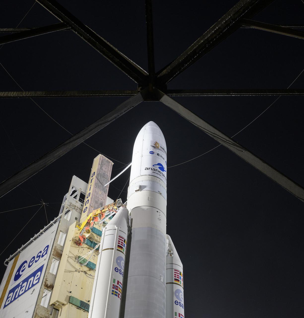 Arianespace's Ariane 5 rocket with NASA’s James Webb Space Telescope onboard, is seen at the launch pad, Thursday, Dec. 23, 2021, at Europe’s Spaceport, the Guiana Space Center in Kourou, French Guiana. The James Webb Space Telescope (sometimes called JWST or Webb) is a large infrared telescope with a 21.3 foot (6.5 meter) primary mirror. The observatory will study every phase of cosmic history—from within our solar system to the most distant observable galaxies in the early universe. Photo Credit: (NASA/Bill Ingalls)