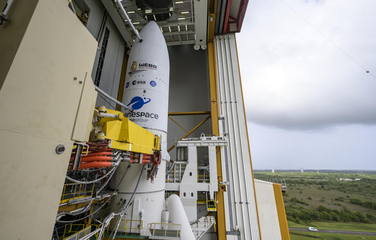Arianespace's Ariane 5 rocket with NASA’s James Webb Space Telescope onboard, is seen ahead of rollout to the launch pad, Thursday, Dec. 23, 2021, at Europe’s Spaceport, the Guiana Space Center in Kourou, French Guiana. The James Webb Space Telescope (sometimes called JWST or Webb) is a large infrared telescope with a 21.3 foot (6.5 meter) primary mirror. The observatory will study every phase of cosmic history—from within our solar system to the most distant observable galaxies in the early universe. Photo Credit: (NASA/Bill Ingalls)