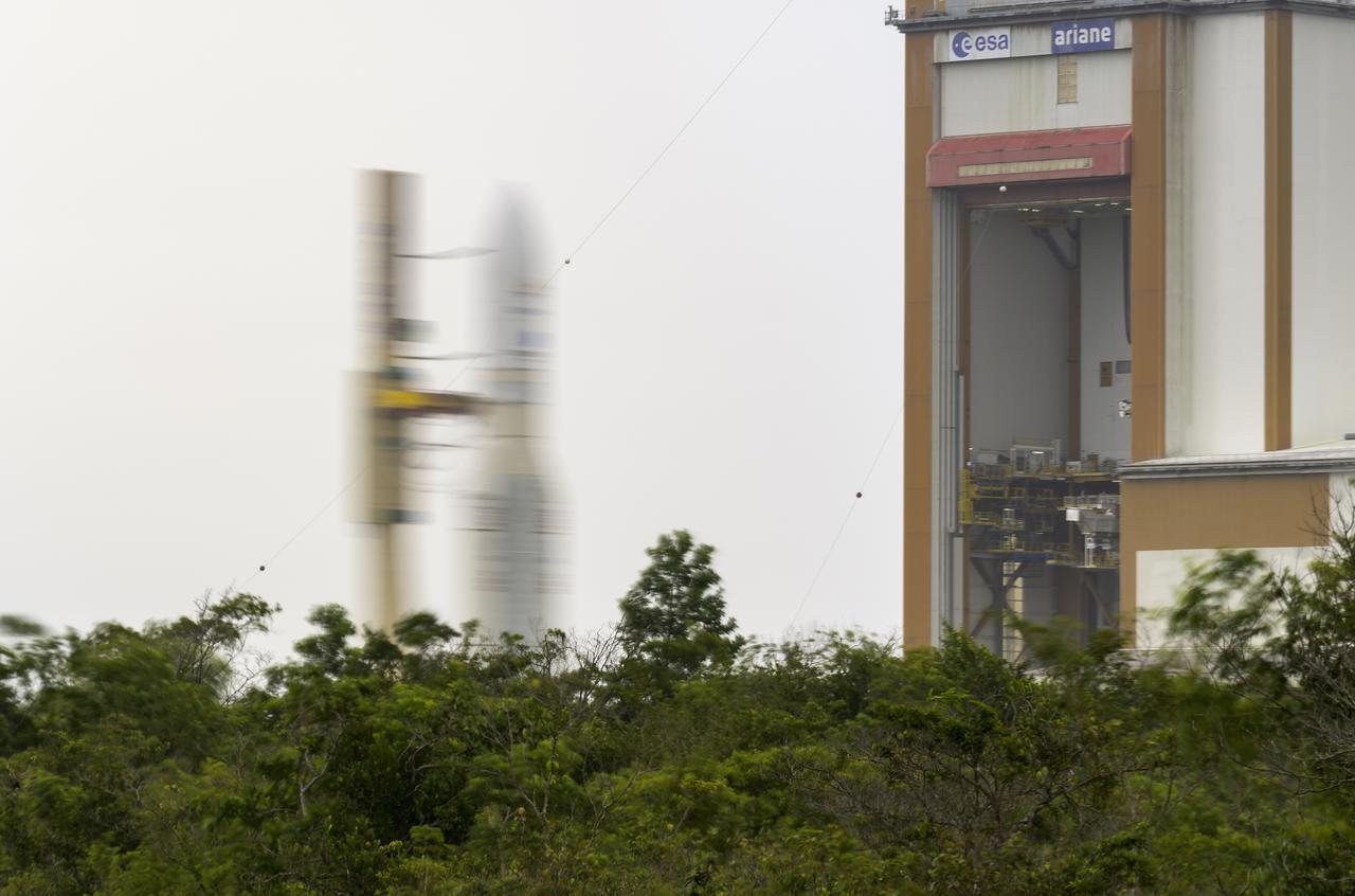 Arianespace's Ariane 5 rocket with NASA’s James Webb Space Telescope onboard, is seen in this 30 second exposure, as it is rolled out to the launch pad, Thursday, Dec. 23, 2021, at Europe’s Spaceport, the Guiana Space Center in Kourou, French Guiana. The James Webb Space Telescope (sometimes called JWST or Webb) is a large infrared telescope with a 21.3 foot (6.5 meter) primary mirror. The observatory will study every phase of cosmic history—from within our solar system to the most distant observable galaxies in the early universe. Photo Credit: (NASA/Bill Ingalls)