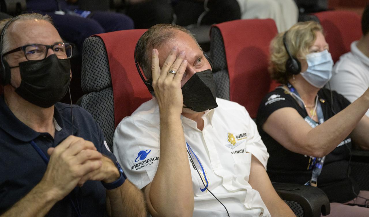 NASA Associate Administrator for the Science Mission Directorate Thomas Zurbuchen, center, reacts after hearing confirmation that the James Webb Space Telescope successfully separated from the Ariane 5 rocket, Saturday, Dec. 25, 2021, in the Jupiter Hall of the Guiana Space Centre in Kourou, French Guiana. The James Webb Space Telescope (sometimes called JWST or Webb) is a large infrared telescope with a 21.3 foot (6.5 meter) primary mirror. The observatory will study every phase of cosmic history—from within our solar system to the most distant observable galaxies in the early universe. Photo Credit: (NASA/Bill Ingalls)