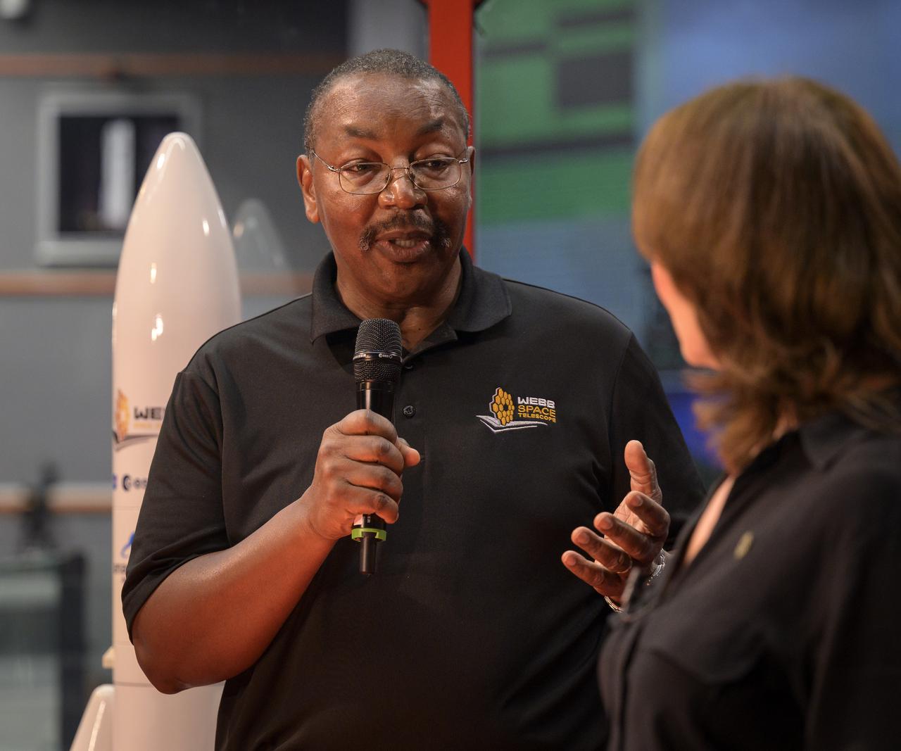 NASA Program Director for the James Webb Space Telescope Program Greg Robinson gives a brief interview on NASA television as he and the launch team monitor the countdown of the launch of Arianespace's Ariane 5 rocket carrying NASA’s James Webb Space Telescope, Saturday, Dec. 25, 2021, in the Jupiter Center at the Guiana Space Center in Kourou, French Guiana. The James Webb Space Telescope (sometimes called JWST or Webb) is a large infrared telescope with a 21.3 foot (6.5 meter) primary mirror. The observatory will study every phase of cosmic history—from within our solar system to the most distant observable galaxies in the early universe. Photo Credit: (NASA/Bill Ingalls)